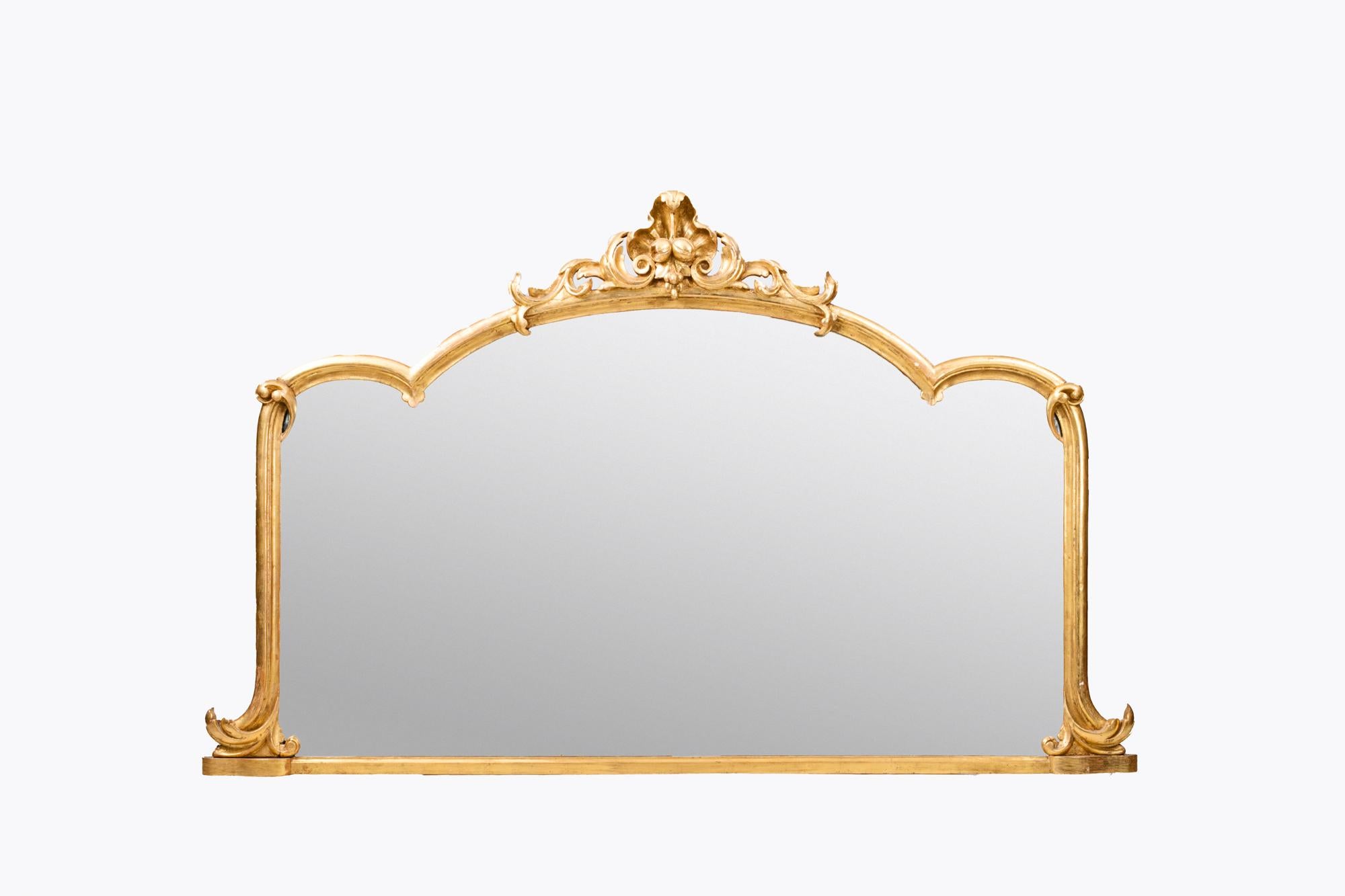 19th Century gilt overmantle mirror with triple-arched frame crested by carved acanthus leaf and foliate motifs with base flanked by delicate acanthus leaf designs.