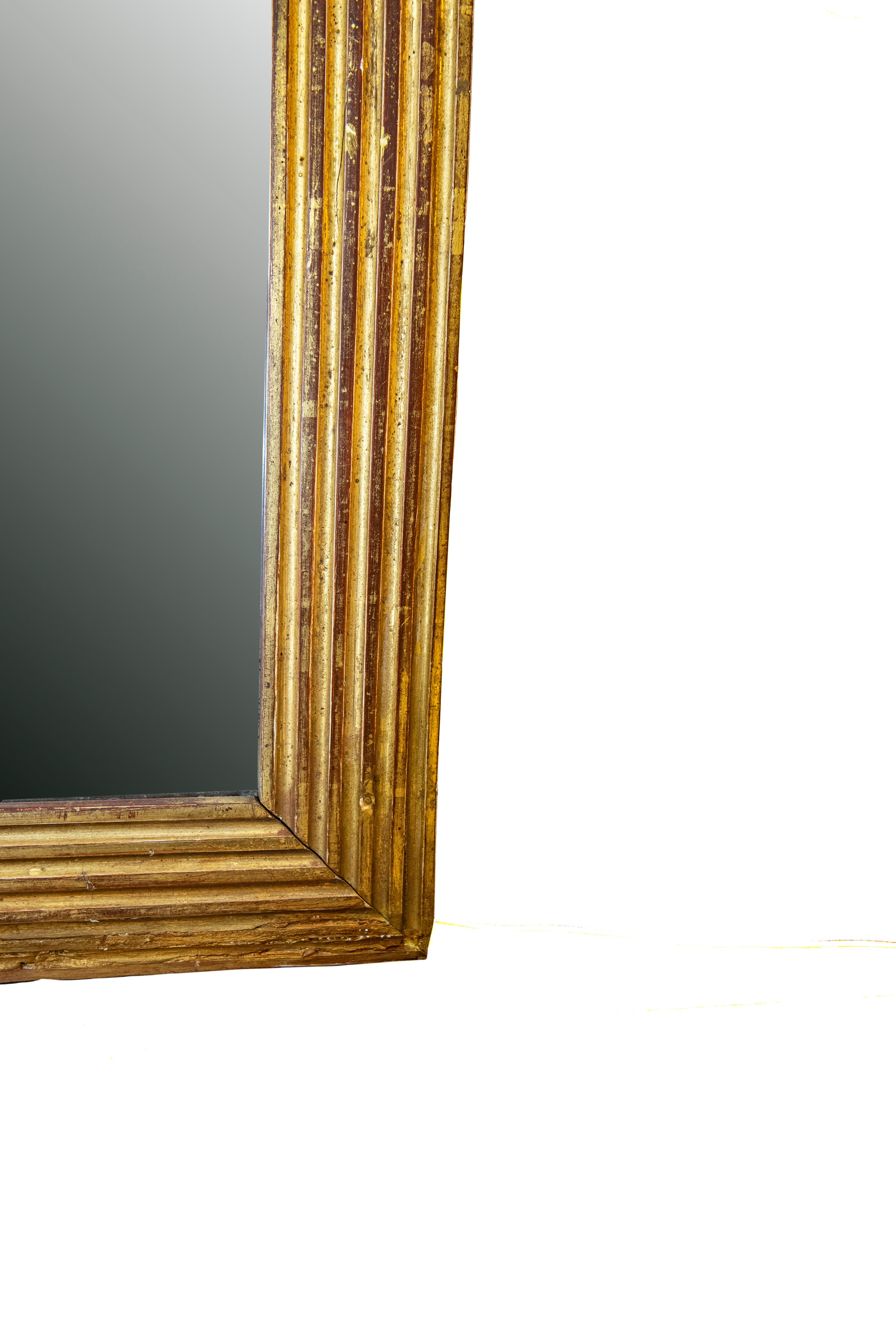 This mirror is in exceptionally good condition. The gilding on this mirror in in very good condone. This mirror could be hung vertically or horizontally,

