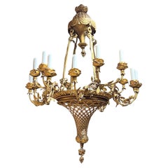 Lustre à 16 éclairages en bronze doré du 19ème siècle de style Louis XVI français