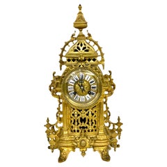 Horloge de cheminée cathédrale du XIXe siècle en bronze doré