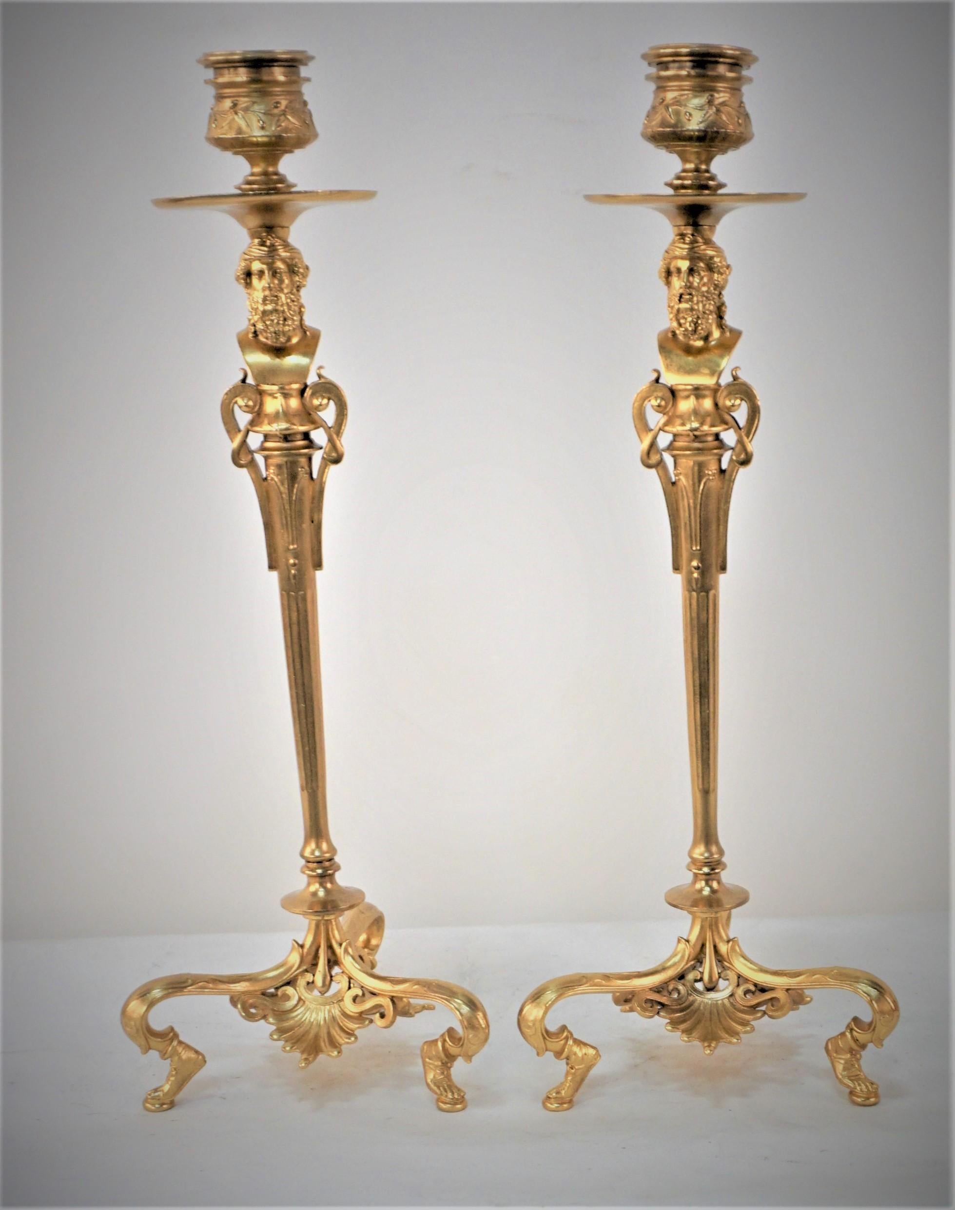 Pair of 19th century gilt bronze candlesticks in classic roman style bust and human feet base by Barbedianne.