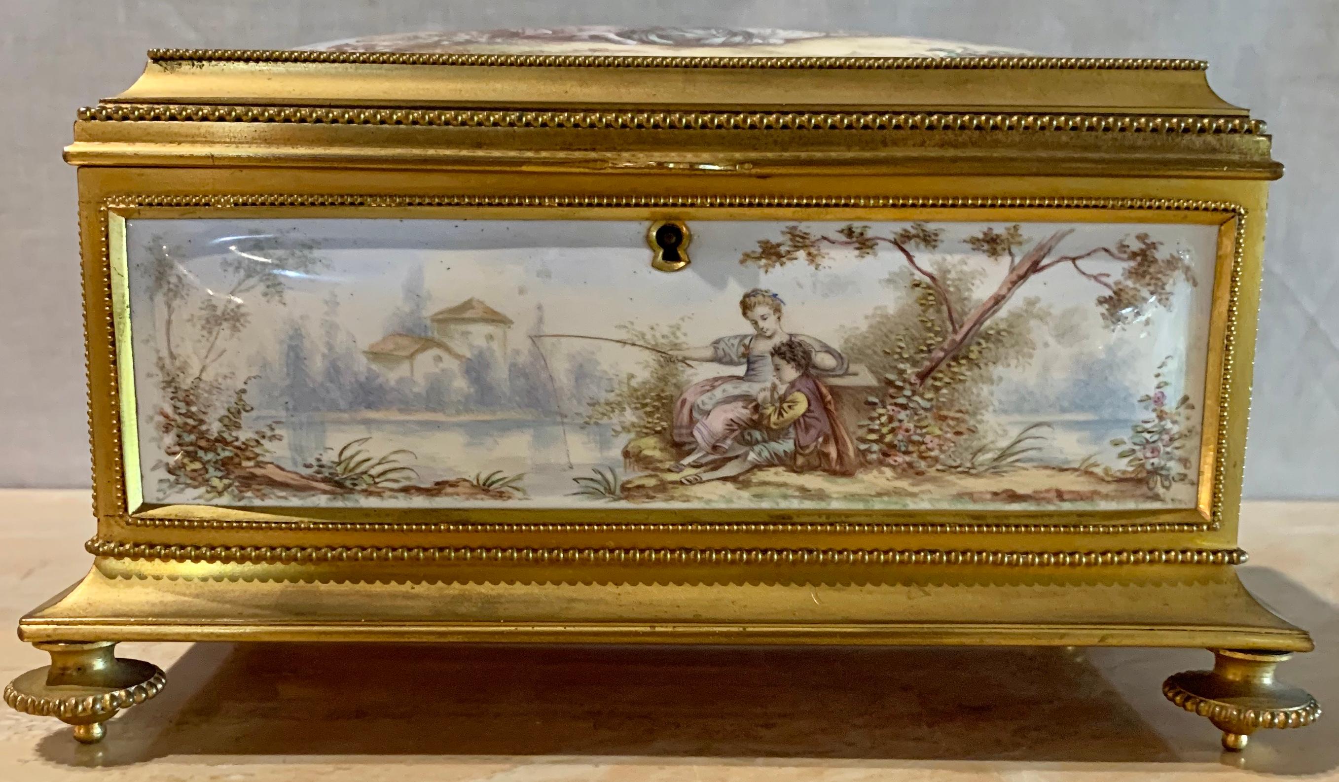 A late 19th century French gilt bronze enameled jewelry casket box having a rose velvet lined interior, unmarked. Measures: Height 5
