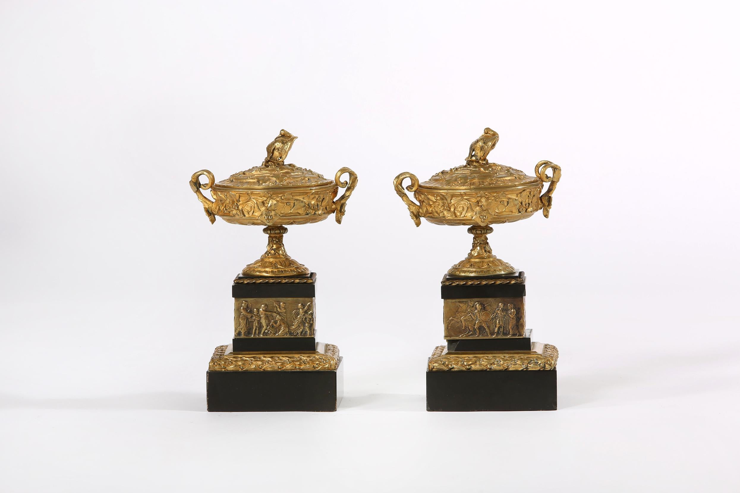 19th century pair of gilt bronze with marble base covered decorative urns / pieces. Each one is in good antique condition with minor loss / chip to marble base. Each decorative urn measures about 10 inches high x 6.5 inches diameter. Base is about 5