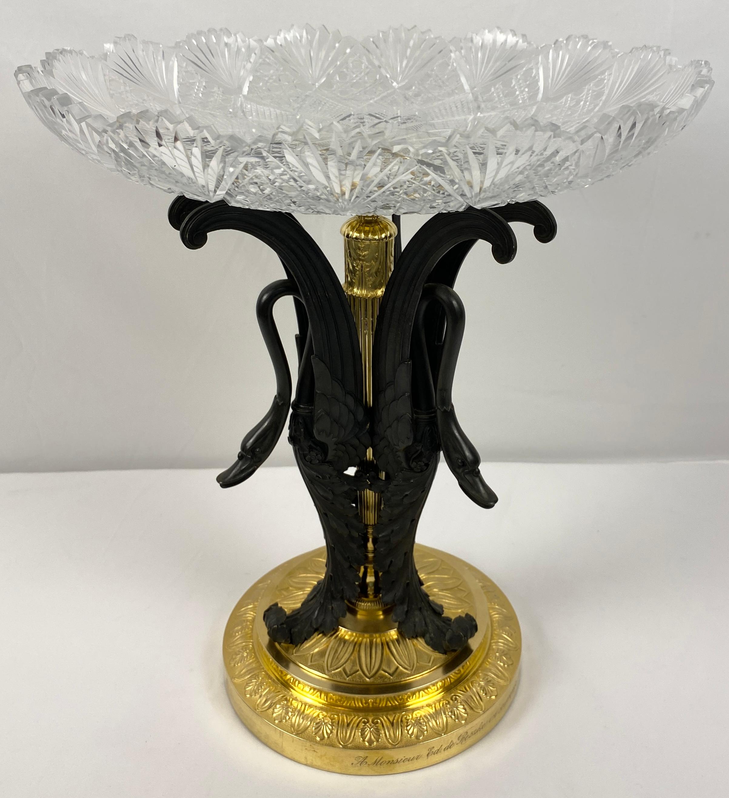 Magnificent French Gilt Bronze and Cut Crystal Centerpiece. 

The crystal tazza is attributed to Baccarat with deeply cut motifs sits atop an ormolu sculpture of three finely hand chiseled Swans on a circular base. 
This is a fine example of the
