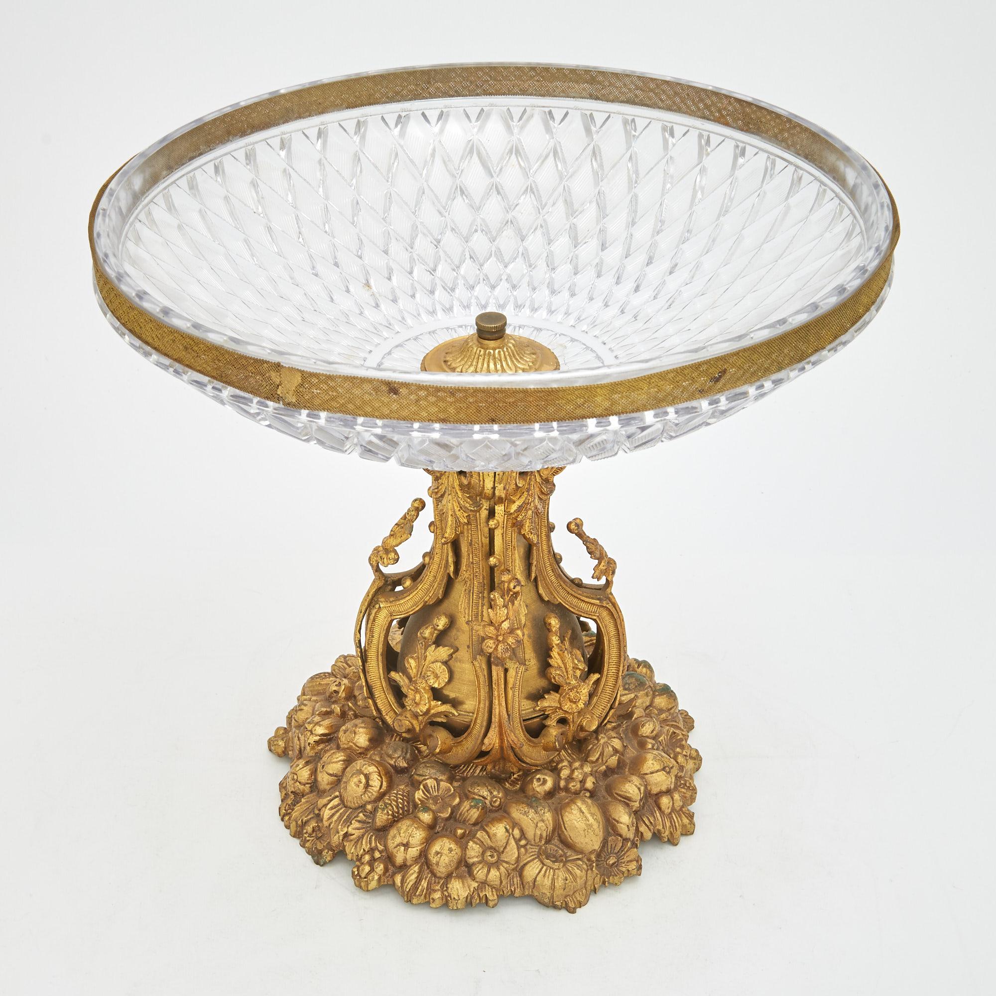 Transport yourself to the grandeur of the 19th century with this exquisite Napoleon III tableware centerpiece. Crafted with meticulous attention to detail, this centerpiece is a harmonious blend of gilt bronze ormolu and molded glass, epitomizing