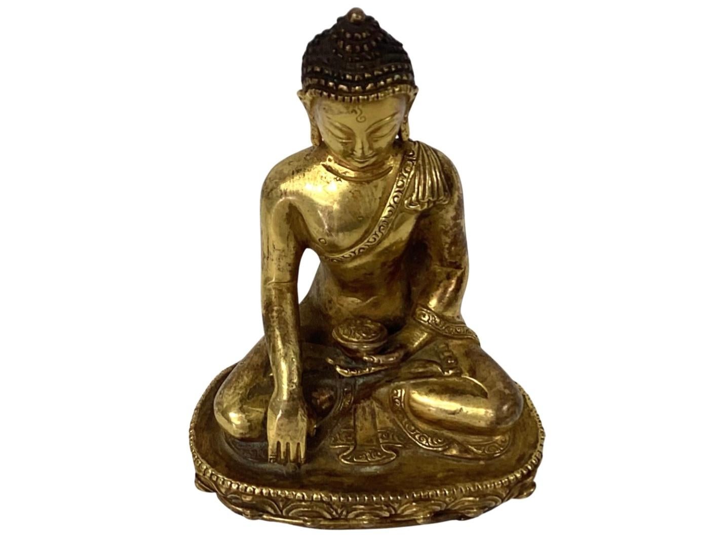 18th century seated gilt bronze buddha. 5.5 inches height. Very good condition.