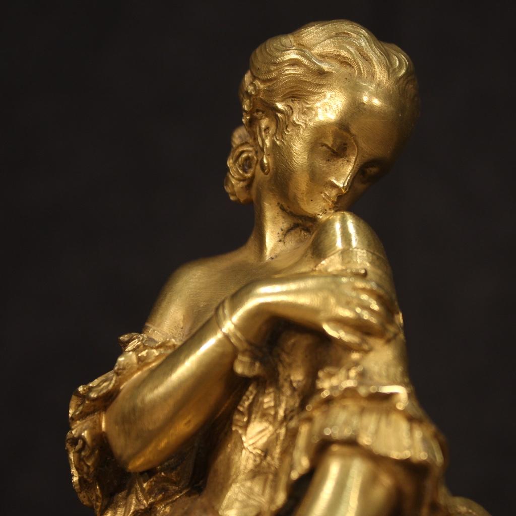 French sculpture from the late 19th century. Object in gilded and chiseled bronze depicting an elegant 18th century style lady with a gray marble base and a white marble base. Beautiful sculpture for antique dealers and collectors. In good condition