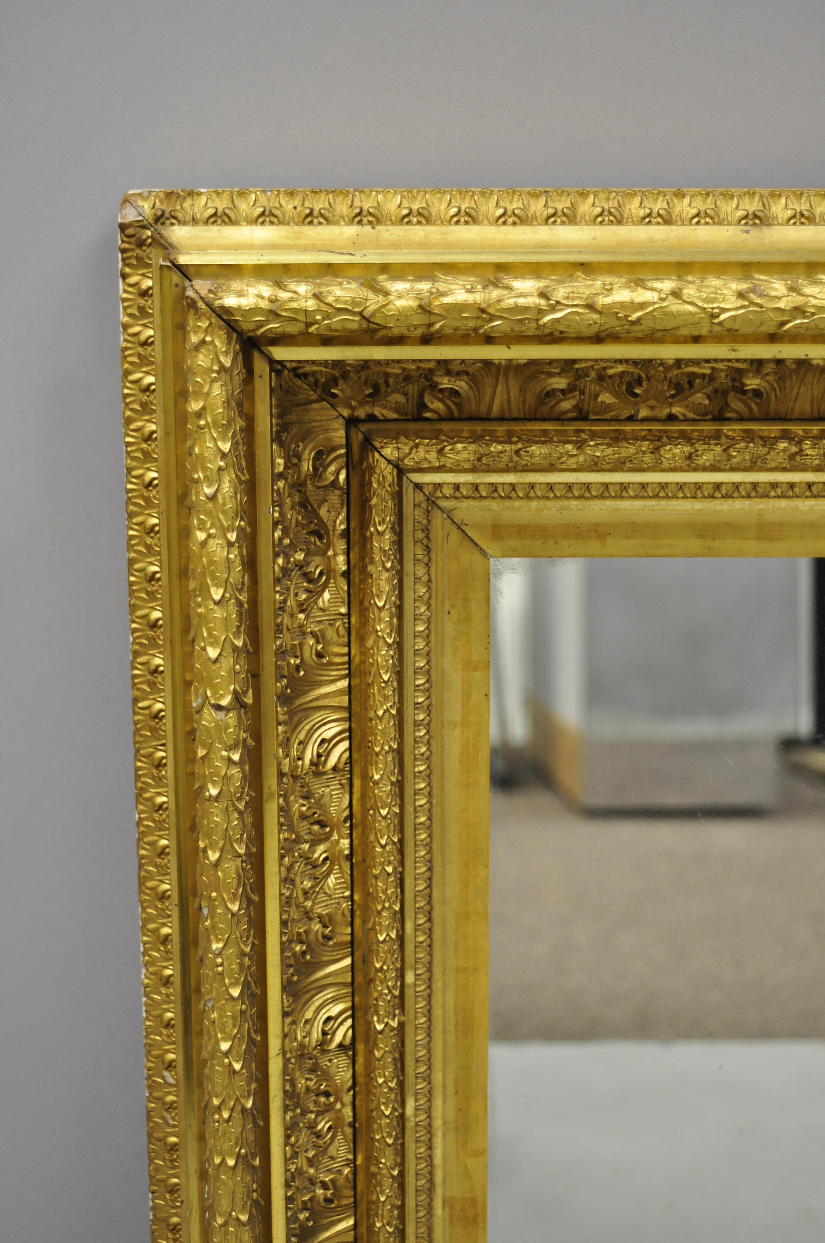 19th century gilt & gesso wood frame wall mirror with foliate design. Item features ornate gold gilt gesso foliate, wooden frame, central mirror, very nice antique item, circa 19th century. Measurements: 30