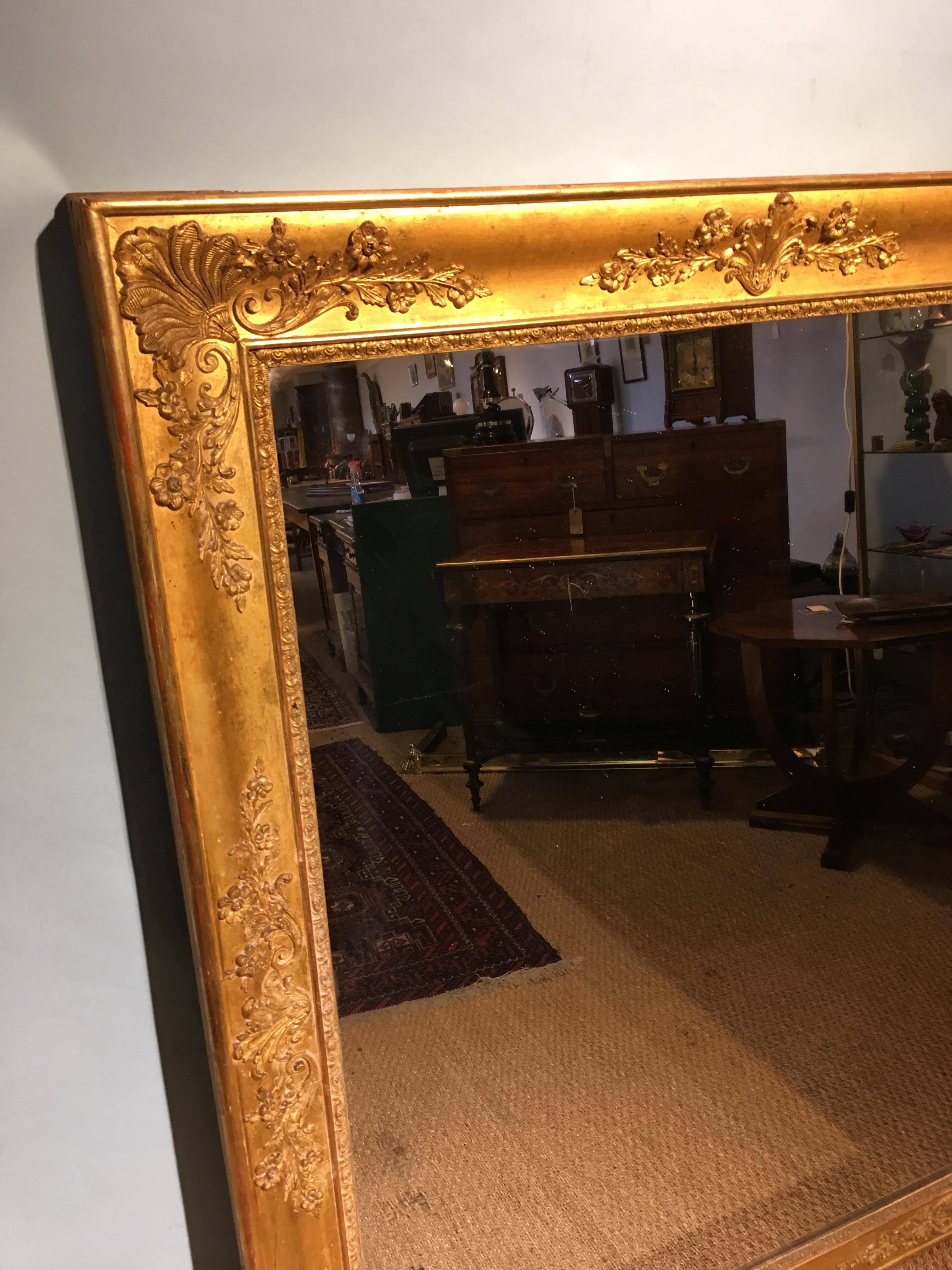 Good sized mid-19th century gilt mirror.

French circa 1840s with original glass and pine back boards 

Measures: Height 51 inches
Width 40 inches.