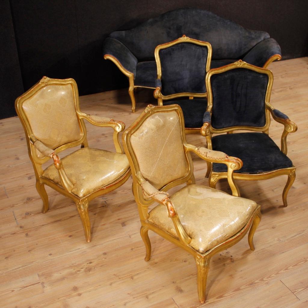 Pair of Italian 19th century armchairs. Furniture in richly carved and gilded wood of excellent quality. Removable seats and backs covered in velvet with some signs of wear. Wooden armrests adorned with velvet insert (see photo). Very elegant