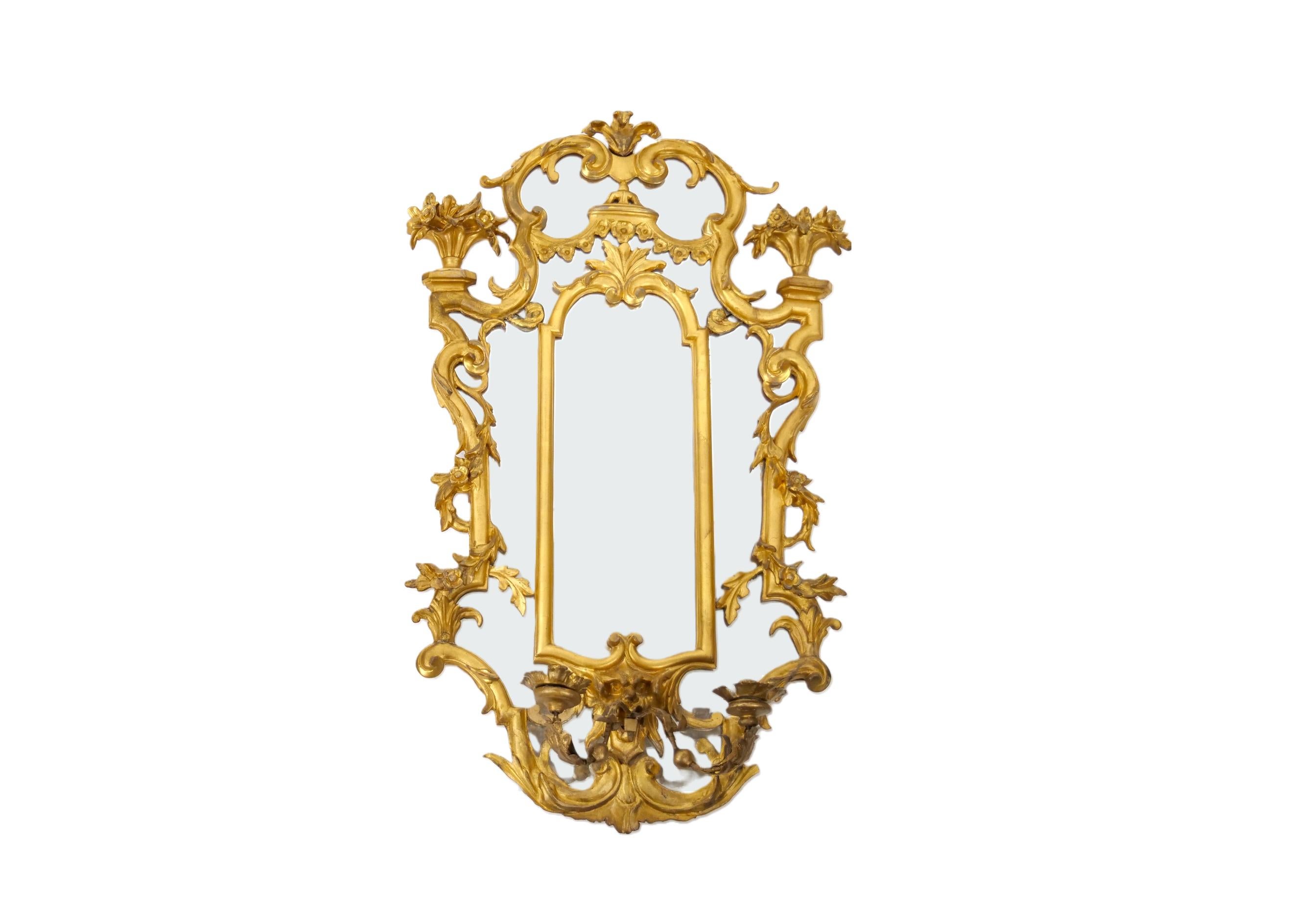 19th century Ornately hand carved gilt wood pair of decorative girandoles hanging wall mirror. Each one is in good condition with appropriate wear consistent with age / use. Each one measure 33 inches high x 23 inches wide x 3 inches deep.