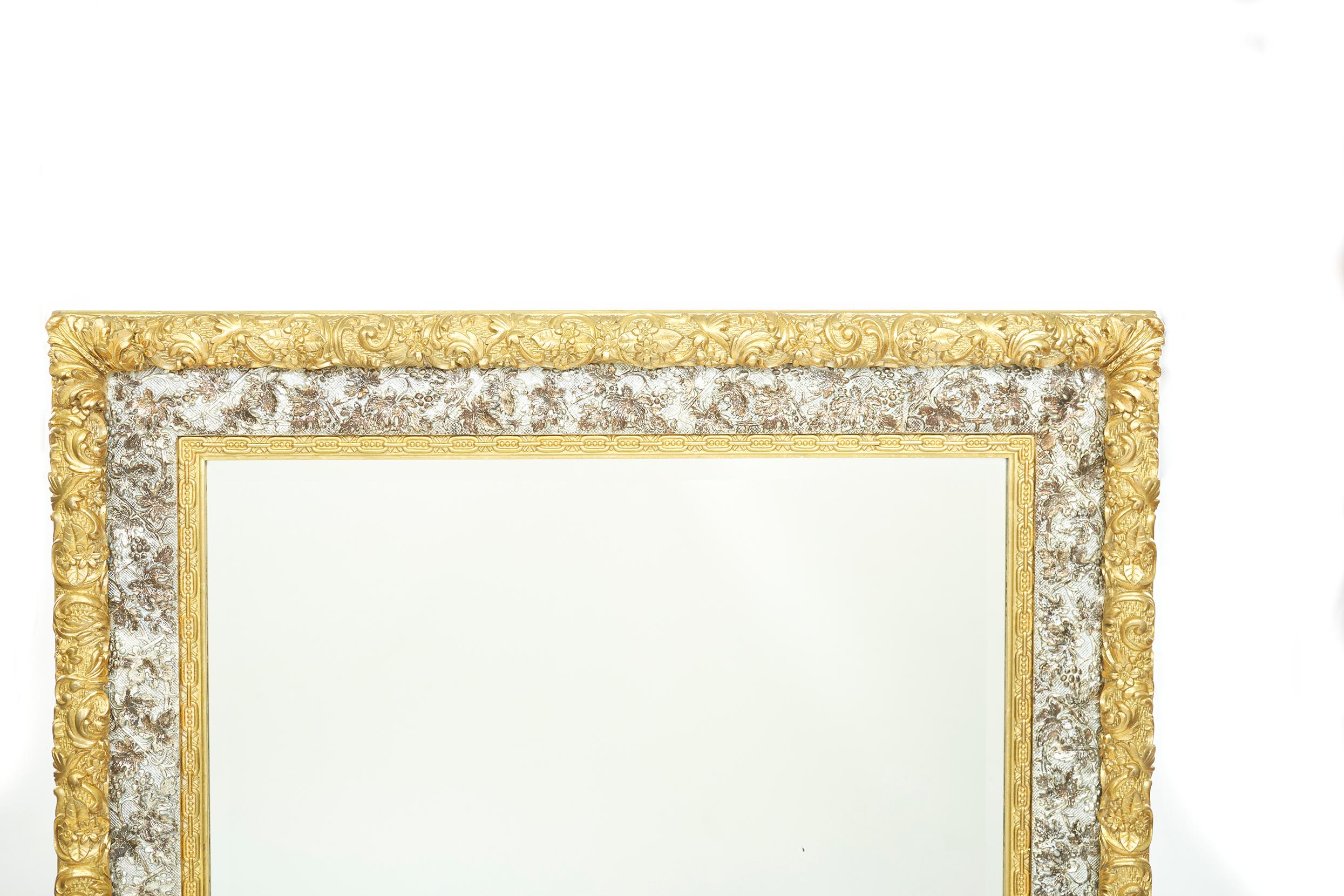19th century neoclassical style gilt wood framed hanging wall mirror with low relief acanthus carve rectangular Shape with two tone gilt framed. The wall mirror is in great condition. Minor wear consistent with age / use. The dimensions are 50