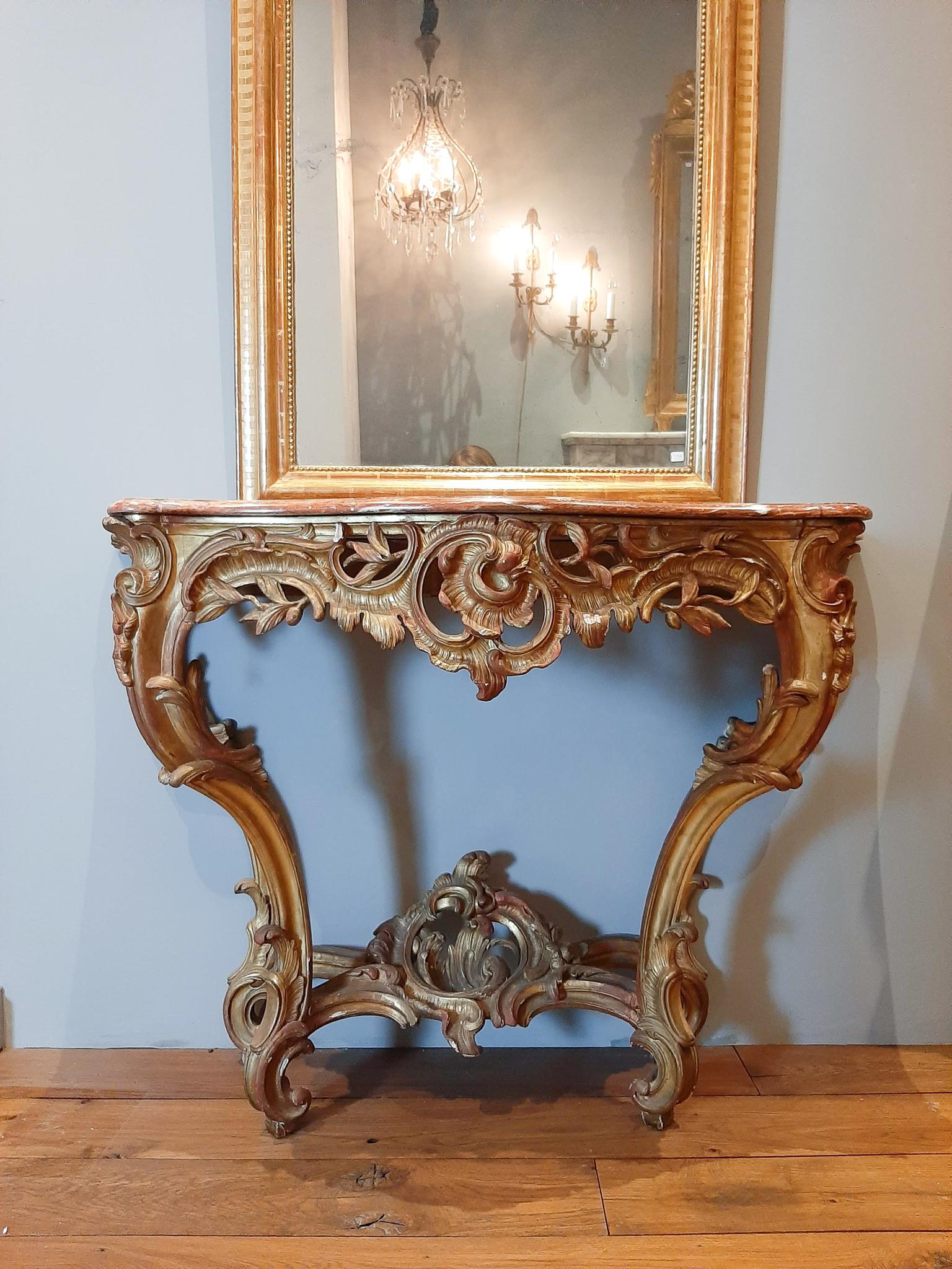 Antique carved and gilded wood console table with red marble top (Incarnat Turquin marble), Rococo, 19th century.

Measures: Height 89 cm x width 124 x depth 53 cm.