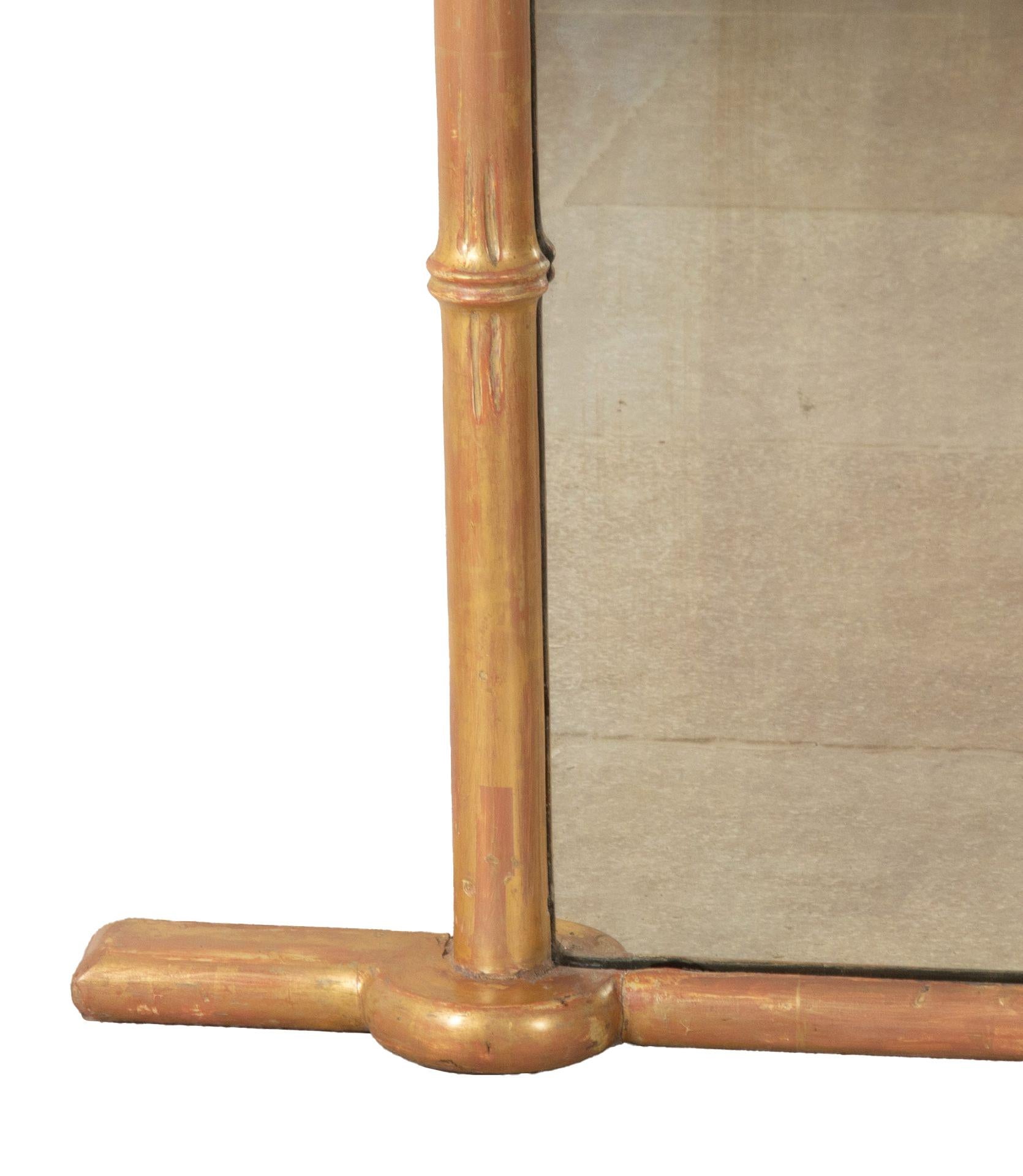 Grande specchio da camino del XIX secolo in legno dorato e finto bambù.

Doratura originale e piatti posteriori