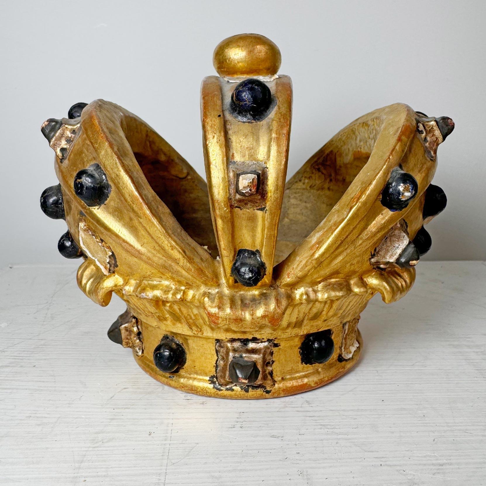 A beautiful and very rare early 19th century Catholic processional Crown, hand crafted in wood with applied gesso and gilt, with rich, dark jewel adornments, (some missing) in wonderful time worn condition, recently unearthed in Lower Saxony in