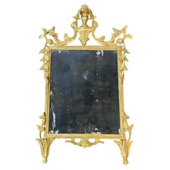 Specchio rococò intagliato in legno d'orato del XIX secolo, probabilmente italiano