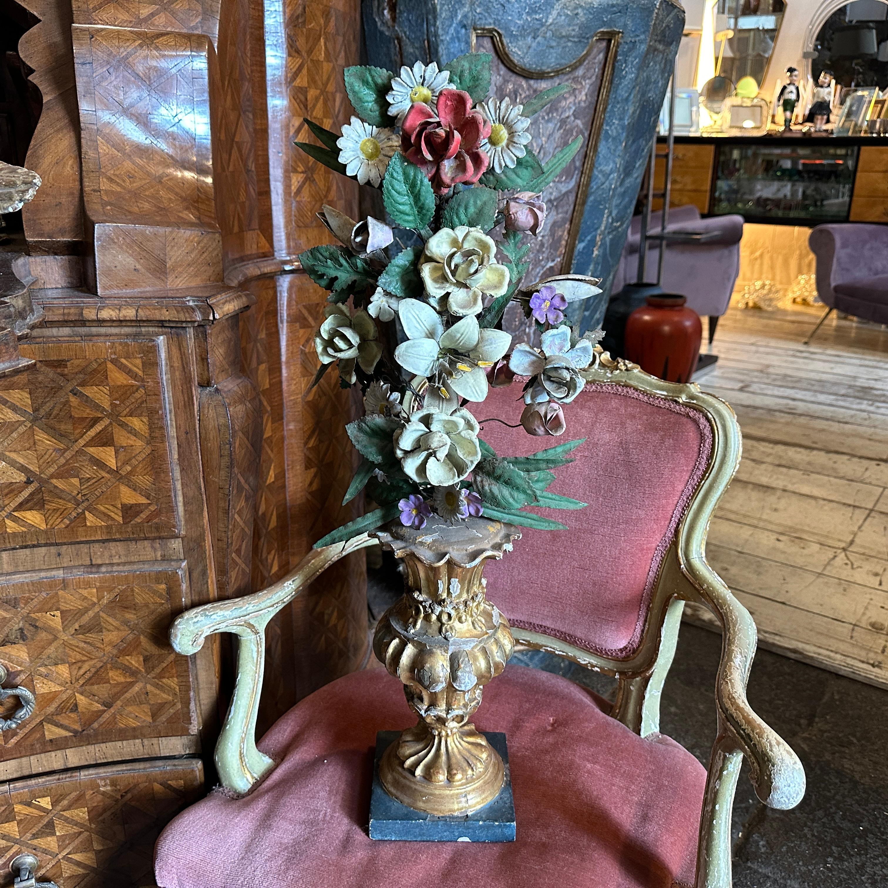 A Sicilian wooden palm holder with an original floral composition, handcrafted in Italy in the late 19th century, features lacquered and gilded wood. The palm holder is in its original condition with signs of use and age. It was used to adorn houses