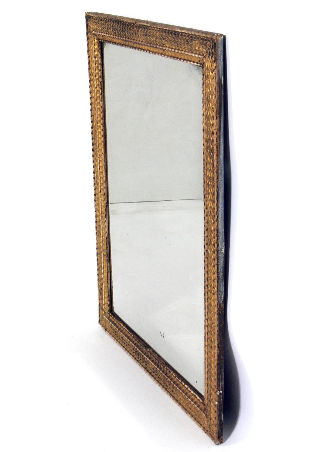 19th century giltwood mirror, American, late 19th century. Retains wonderful original patina to the original mirrored glass and the gilt wood frame.