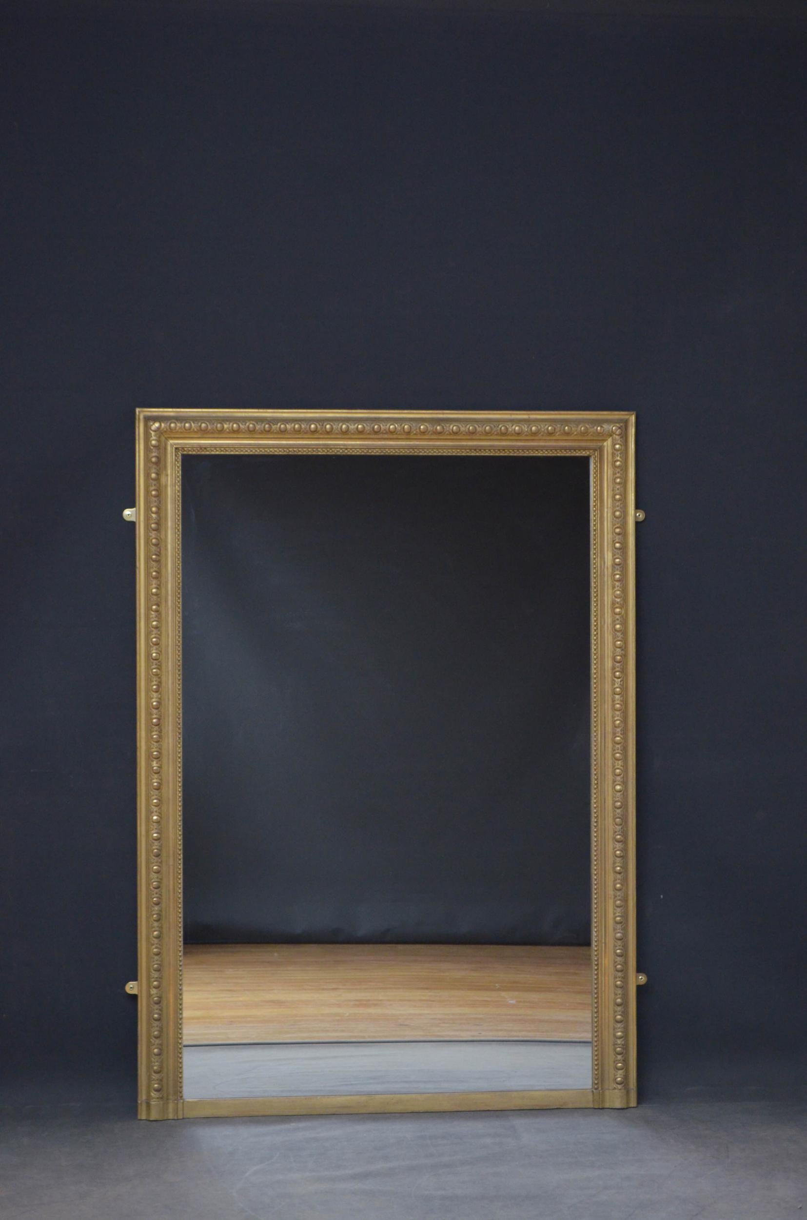 J00 large 19th century gilded wall mirror, having a replacement glass in beaded, shaped and carve rectangular frame. This antique mirror retains original gilt with replaced glass and backboards. All in wonderful home ready condition throughout,
