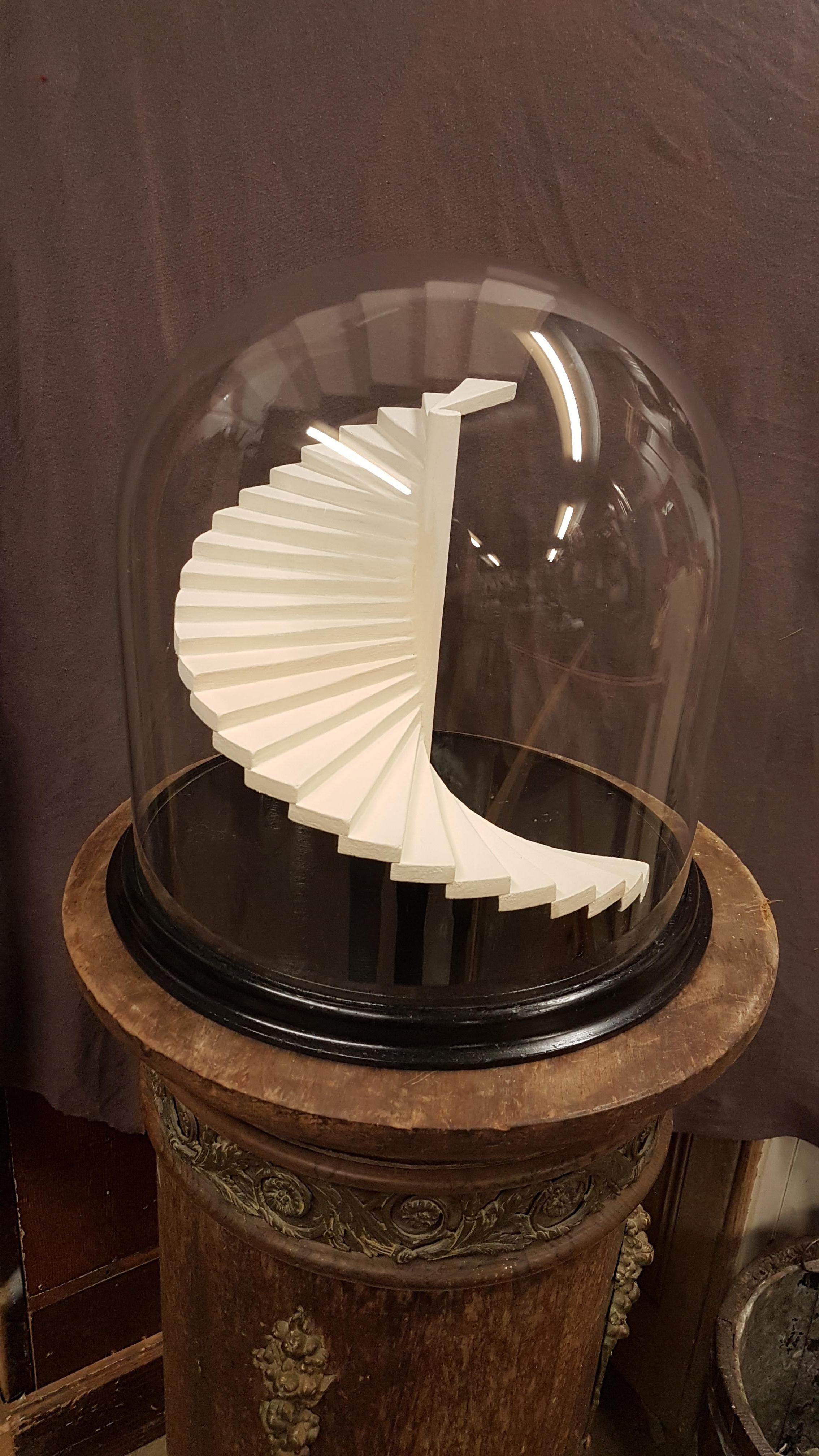A large scale Victorian glass dome with ebonised base that I designed and built a miniature staircase inside of for display. There are many varieties of miniature architects staircase models around but none of them were what I was after so I