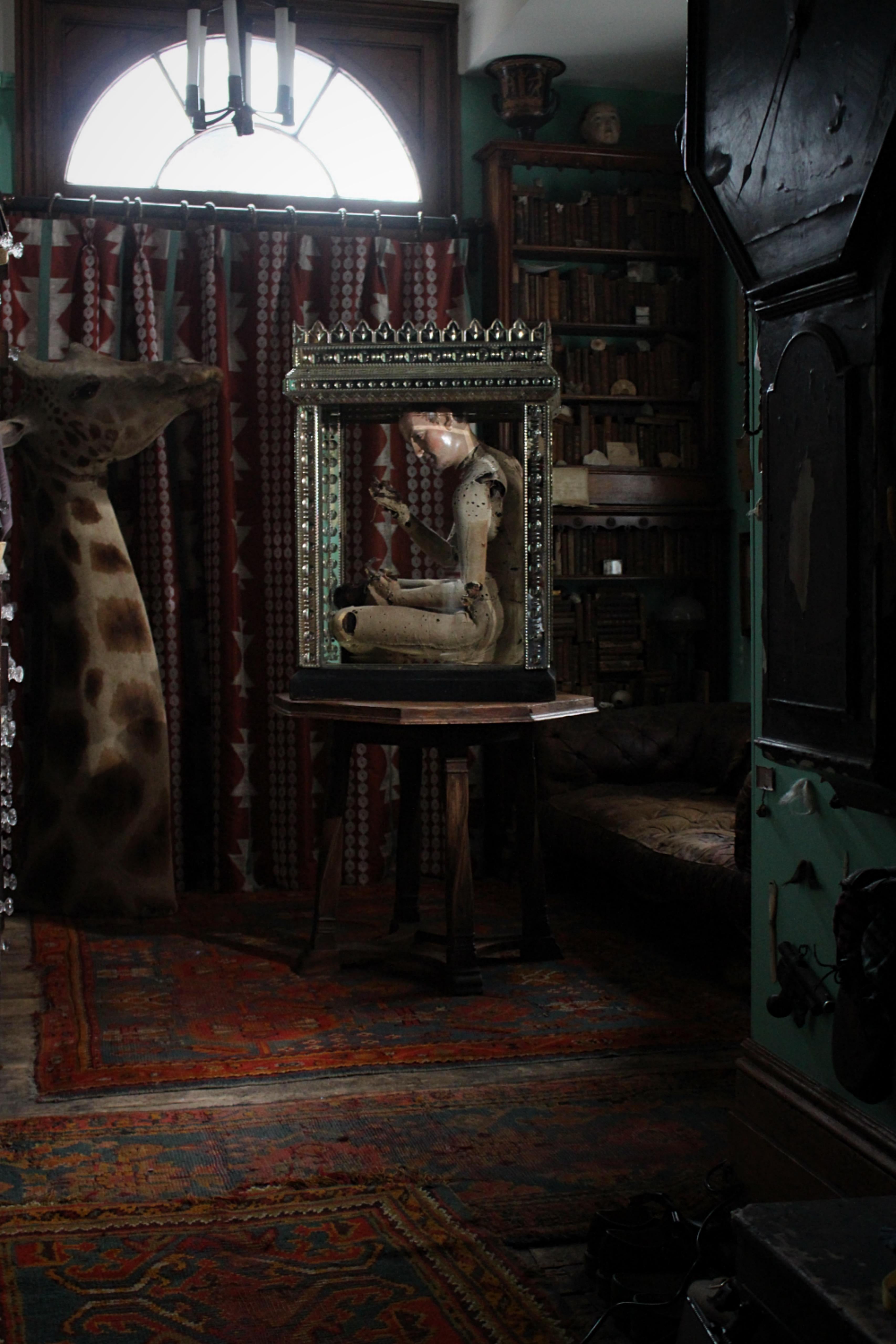A very unusual continental display case, a hefty wooden carcass is encased with thick mirrored glass in side and out. The glass itself is profusely decorated with reverse ground optics and floral etchings. The mirror plate is beautifully foxed and