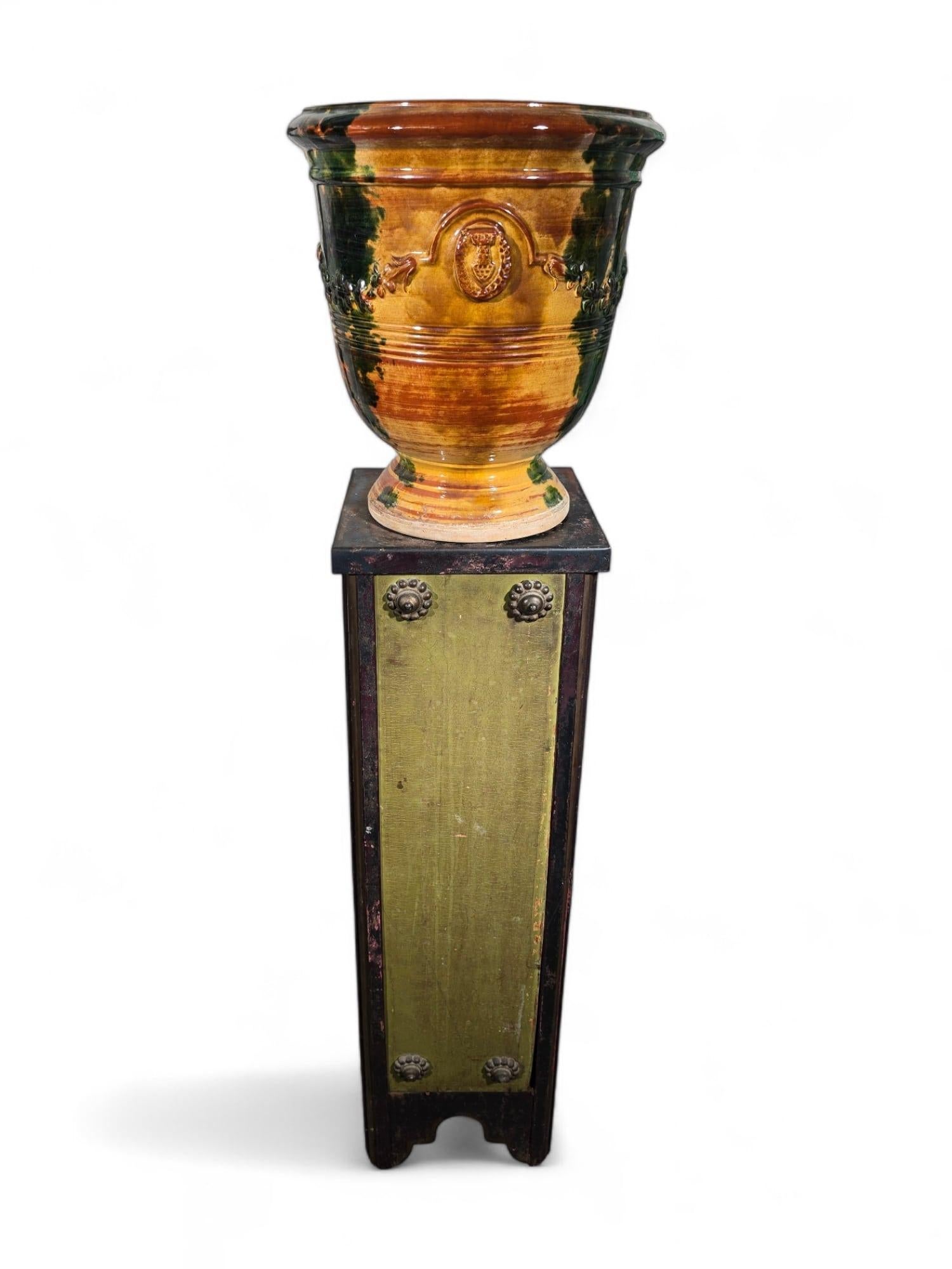 Elevate your home decor with this exquisite decorative planter, a stunning piece of glazed ceramic art from approximately 1890. This 19th-century macetero embodies the charm and craftsmanship of its era, making it a perfect addition to any garden or