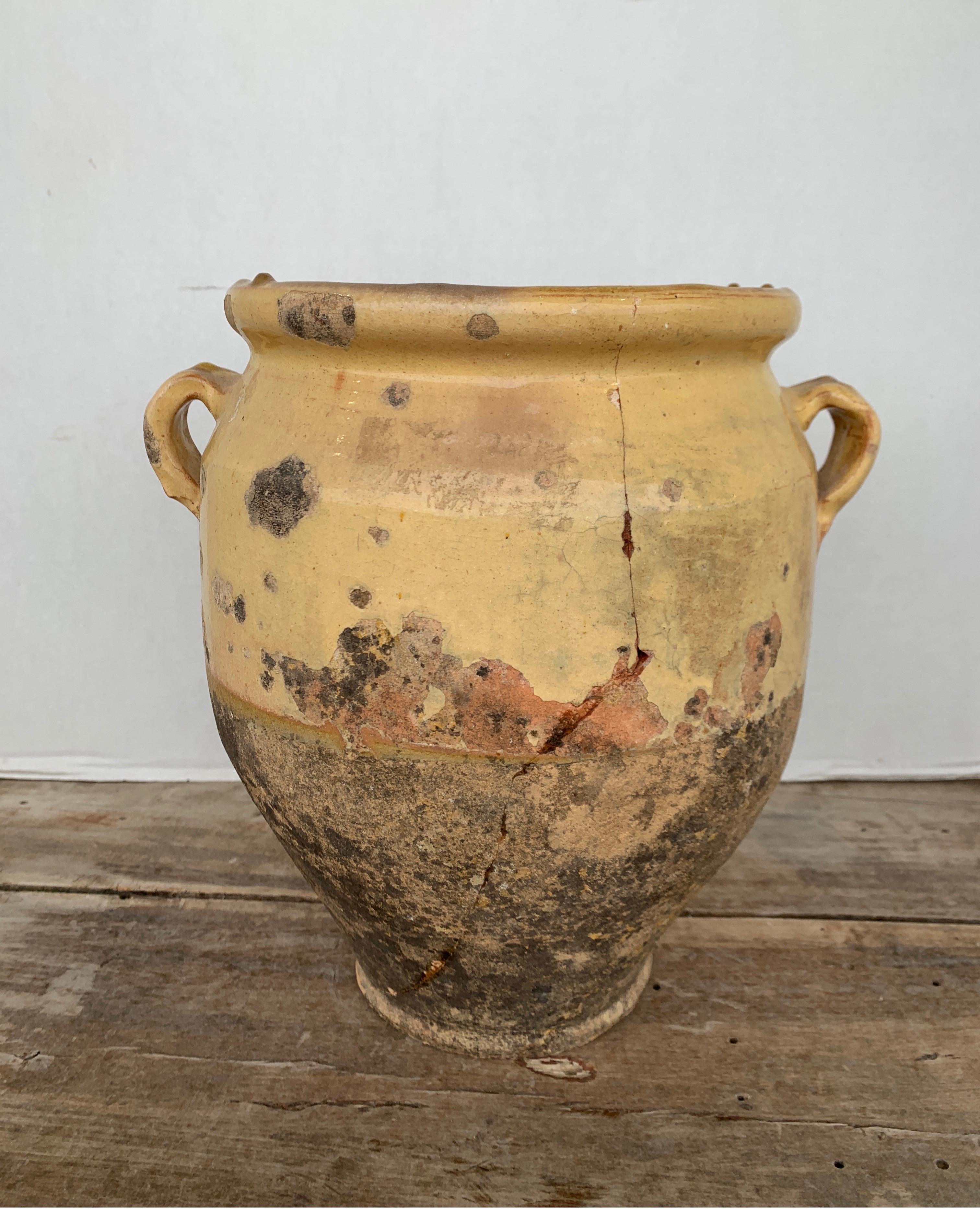 Gorgeous patina on this well used jar from the Southern part of France. Measures: 11 W x 9 D x 11 T. There are some visible cracks that I have enclosed several photos of.