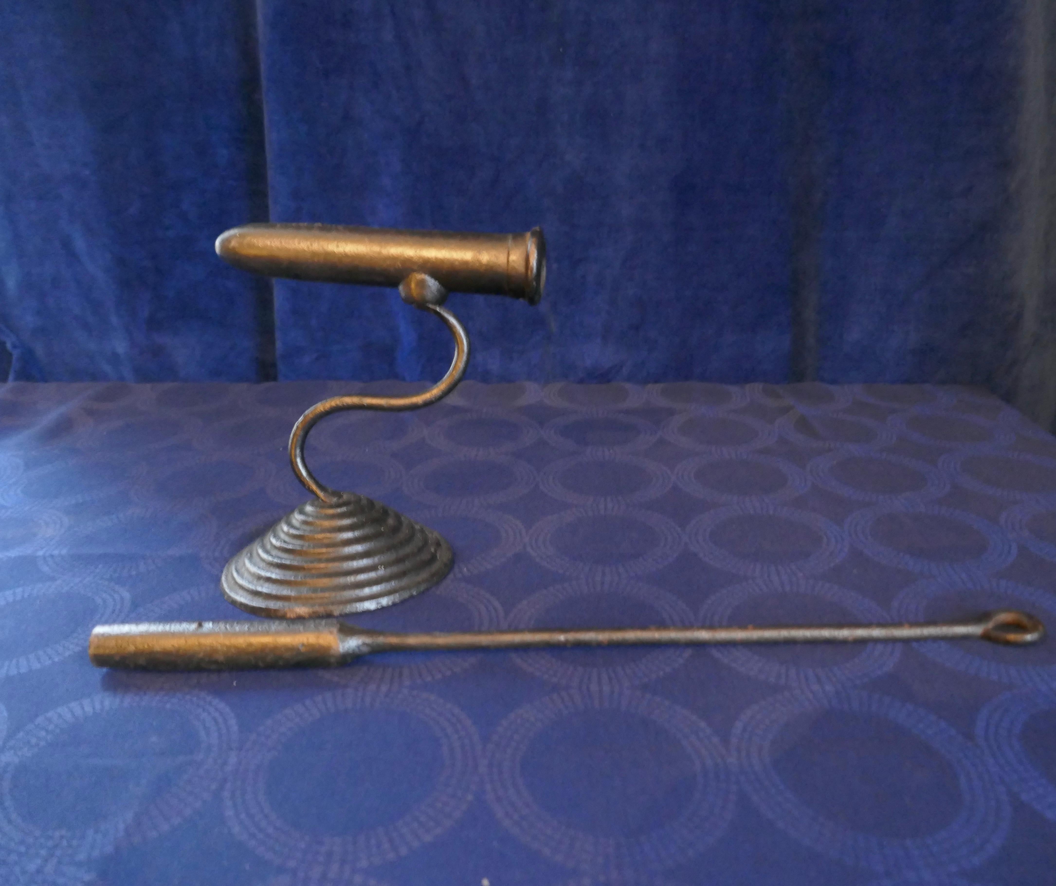 19th century goffering flat iron (or tally iron) complete with heating poker

Introduced in the 17th century an iron like this is used to make the frills and pleats in linen and other fabrics
The iron was heated with a long cylindrical poker