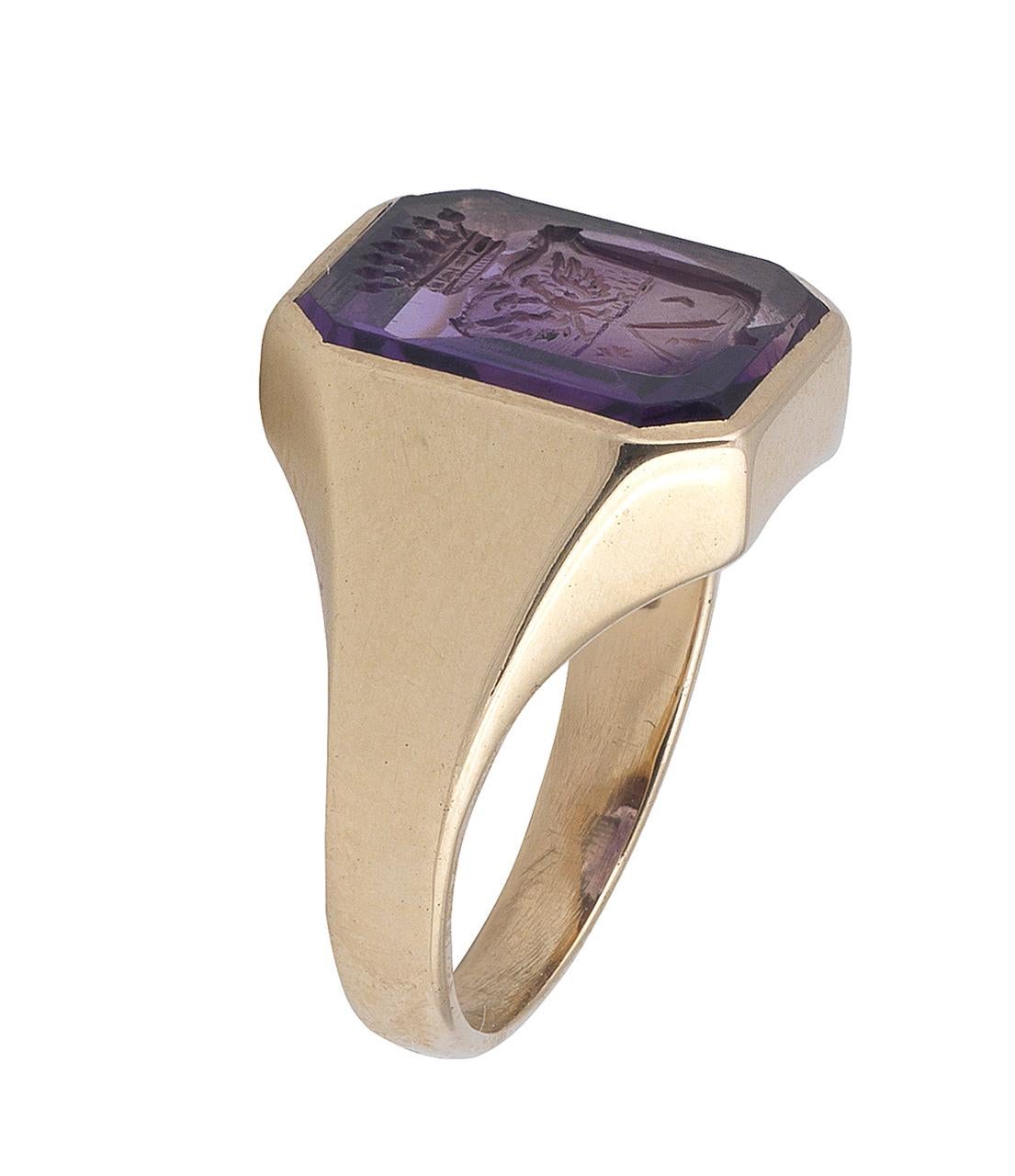 The octagonal amethyst seal, carved to depict a double-headed eagle over a pyramid, beneath a Count  crown, of the Counts Caramelli of Lombardy. Ring size 6. Weight 6.8gms. 