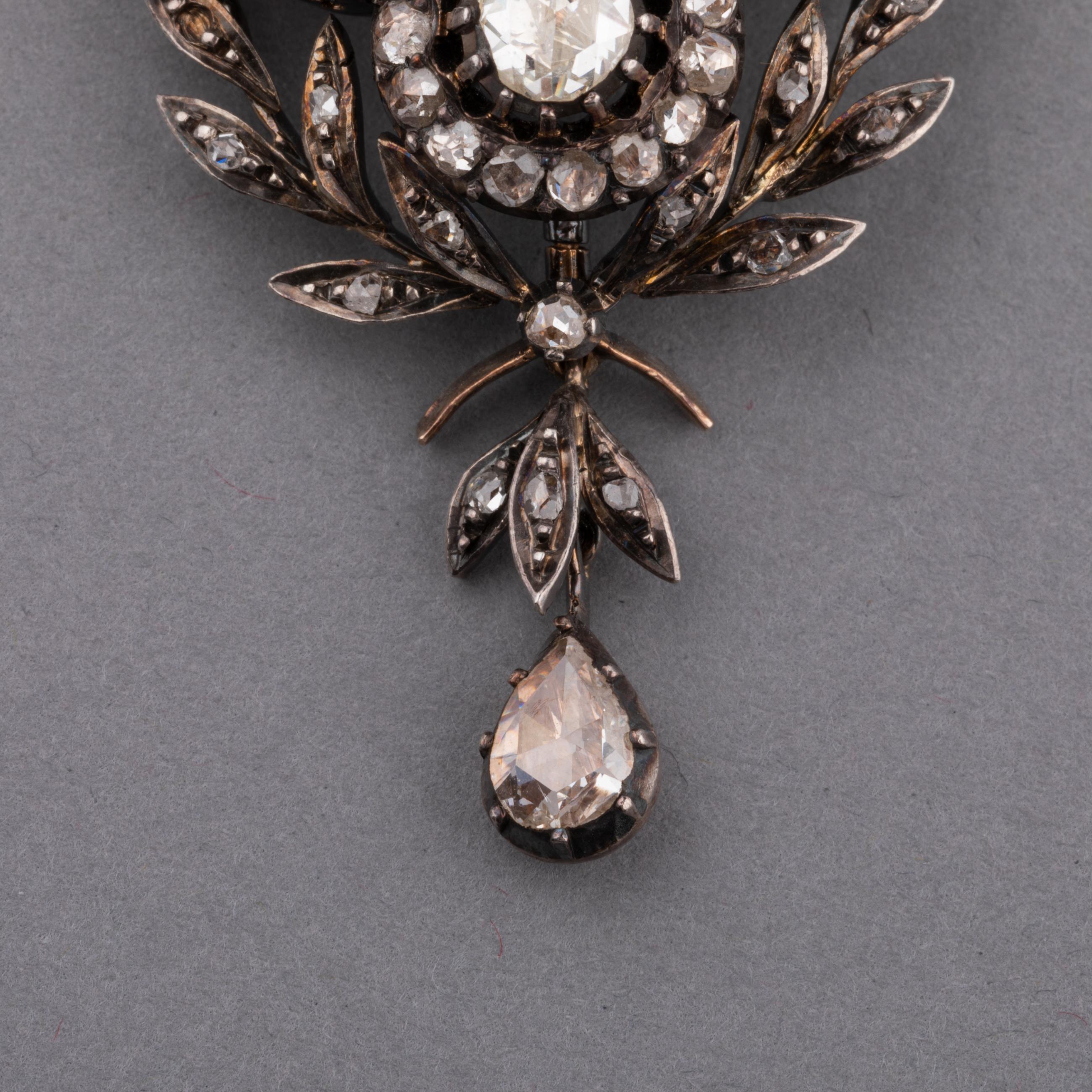 A lovely antique pendant, possible to add a chain.
Made in France circa 1860. Made in rose gold 18k and silver.
The diamonds are rose cut, 3 carats total approximately.
Dimensions: 65 mm height and 30 mm width.
Weight:16.40 grams.