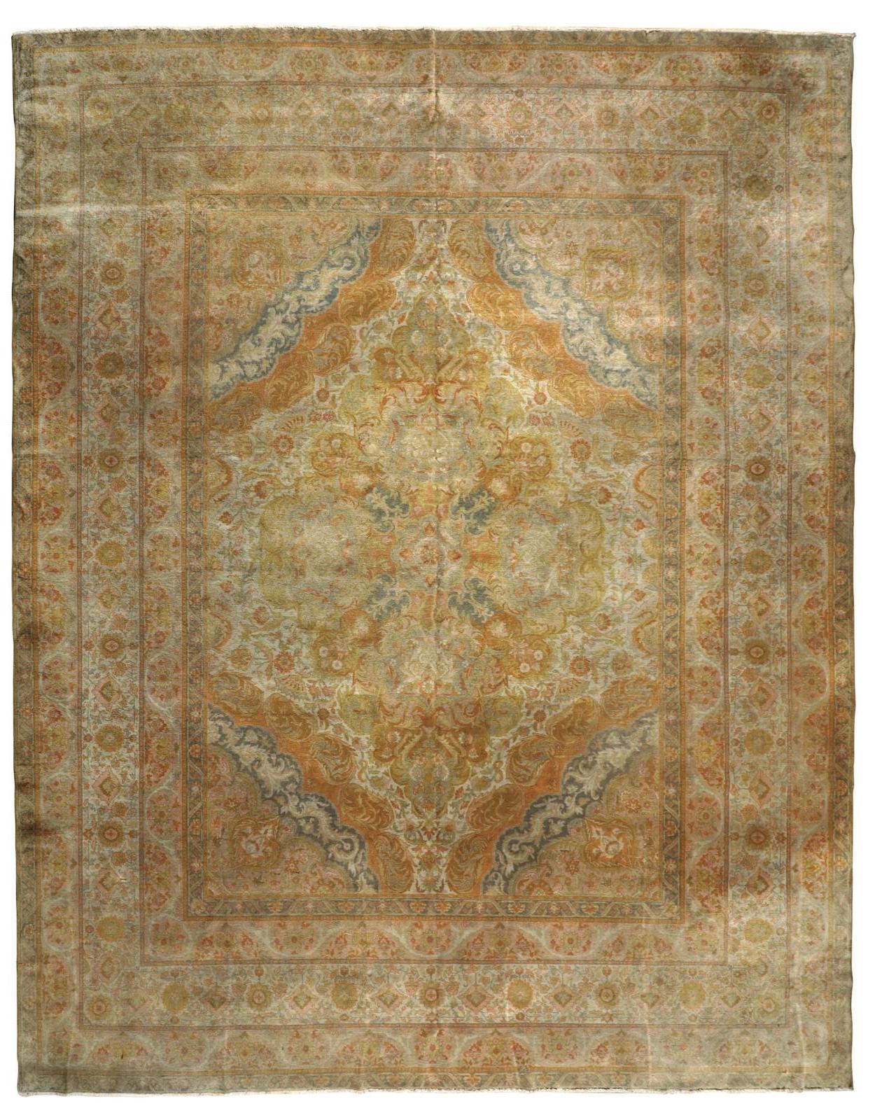 An Indian production rug in pastel tones. A large beige medallion sits in a field of delicate colors creating a shaded effect. Even the rich border decorated with floral elements, does not detach from the center and creates with this a set of light