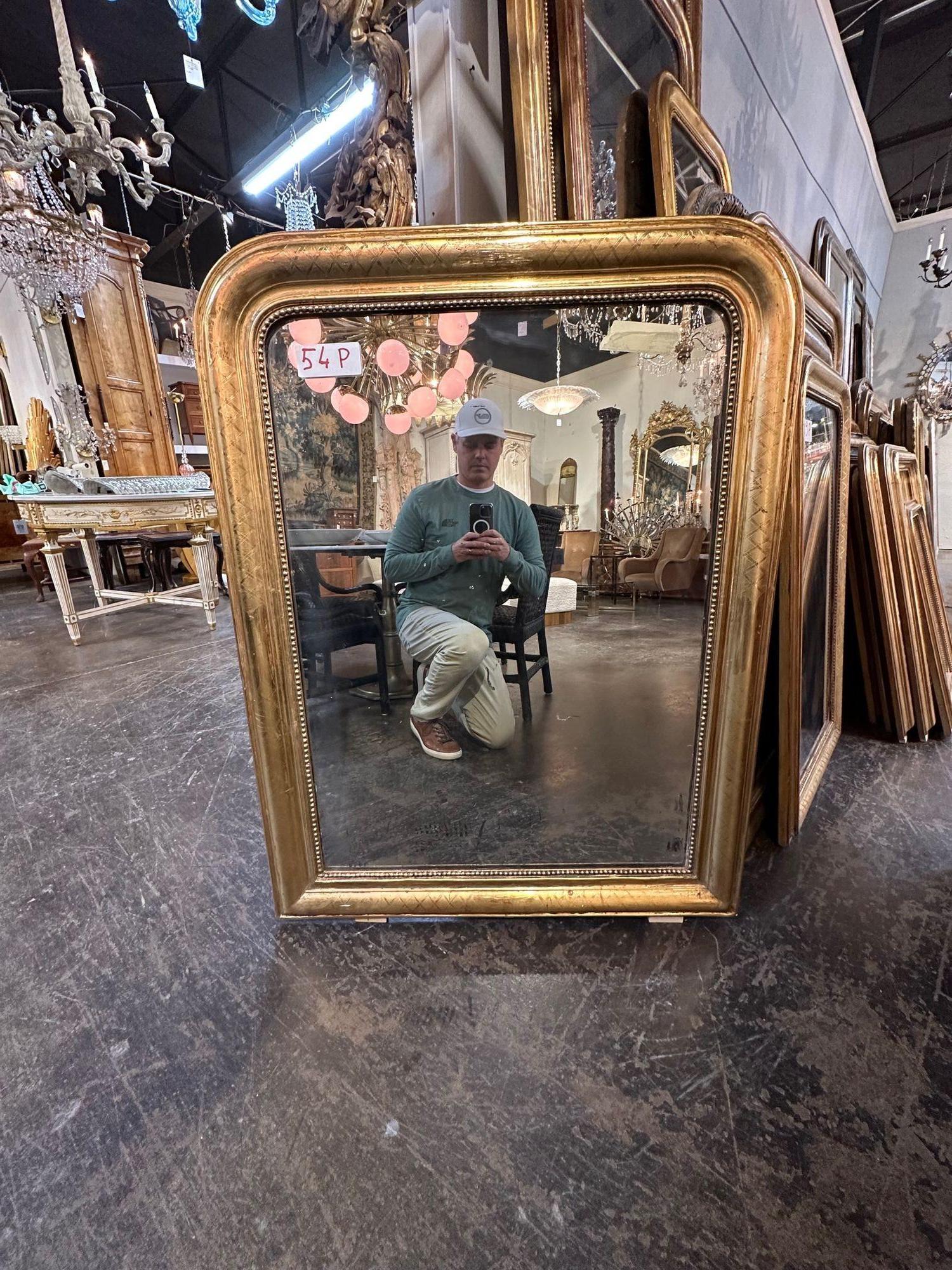 Lovely 19th century Gold Louis Philippe mirror with X pattern. Great for a variety of decors. So pretty!.