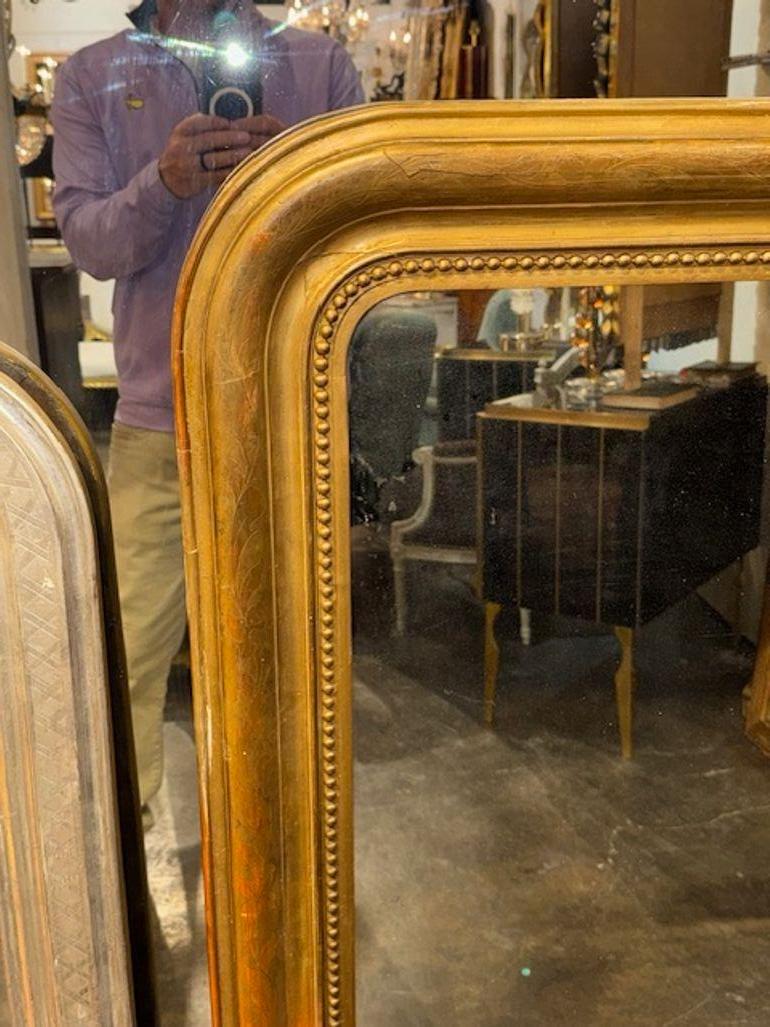 Français Miroir Louis Philippe du 19ème siècle doré avec motif floral en vente