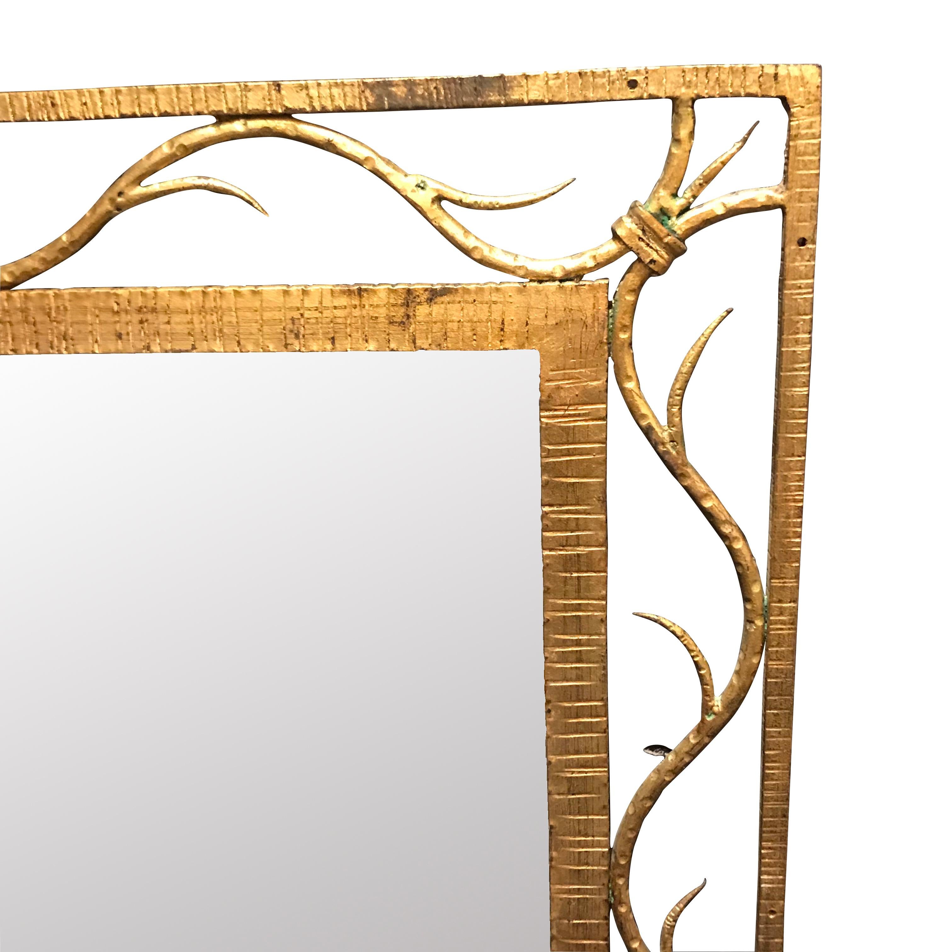 19th century French gold gilt metal mirror with scroll design inserted between the inner and outer frame.