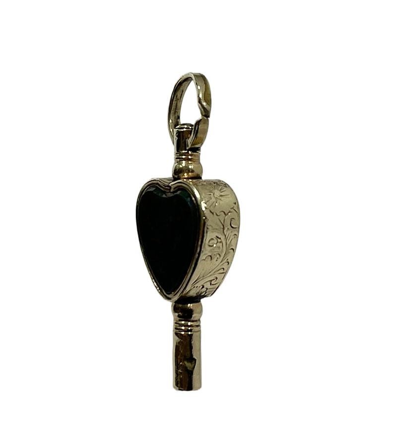 19th century brass and gold Watch-Key with each side a different stone in the shape of a heart

Agate works grounding, stabilizing and protective.
Heliotrope is a protective, grounding and purifying stone. Helps you when you are extremely tired and