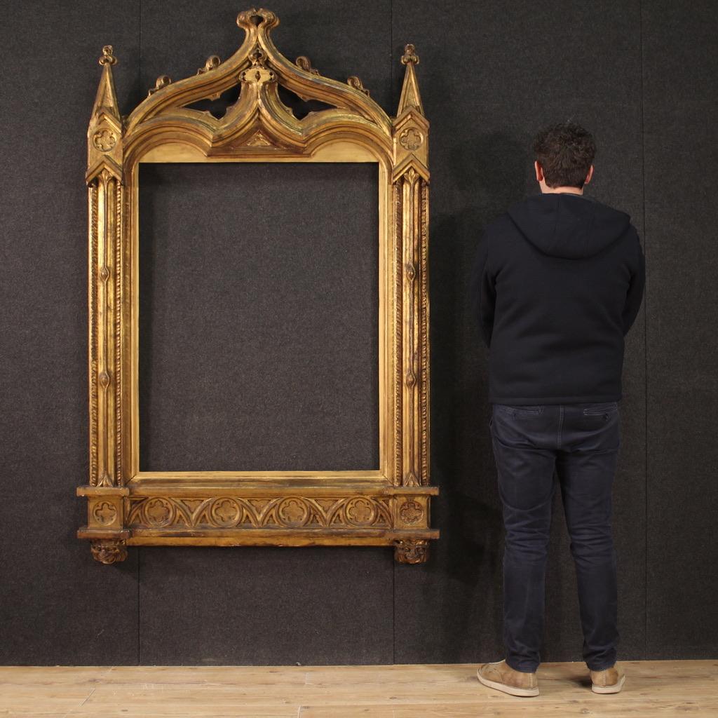 Great late 19th century Italian neo-Gothic frame. Item in wood and plaster finely carved and gilded (bronze tint), of great size and impact. Frame equipped with a gilded wooden passe-partout added during the 20th century (see photo) that is easily