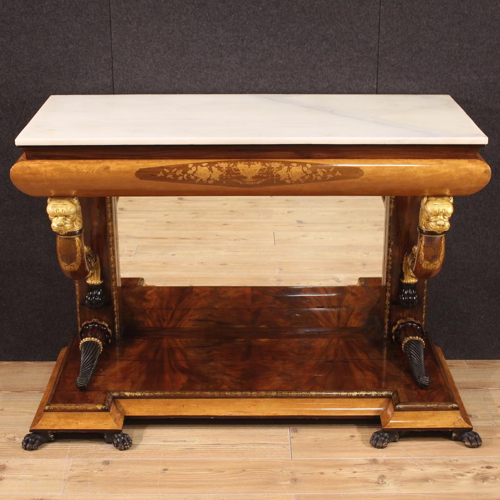 Elegant Spanish console table from the second half of the 19th century. Furniture of exceptional quality in mahogany, walnut, ebonized wood, gilded wood and light wood. Console finely adorned with zoomorphic decorations supporting the top and base.