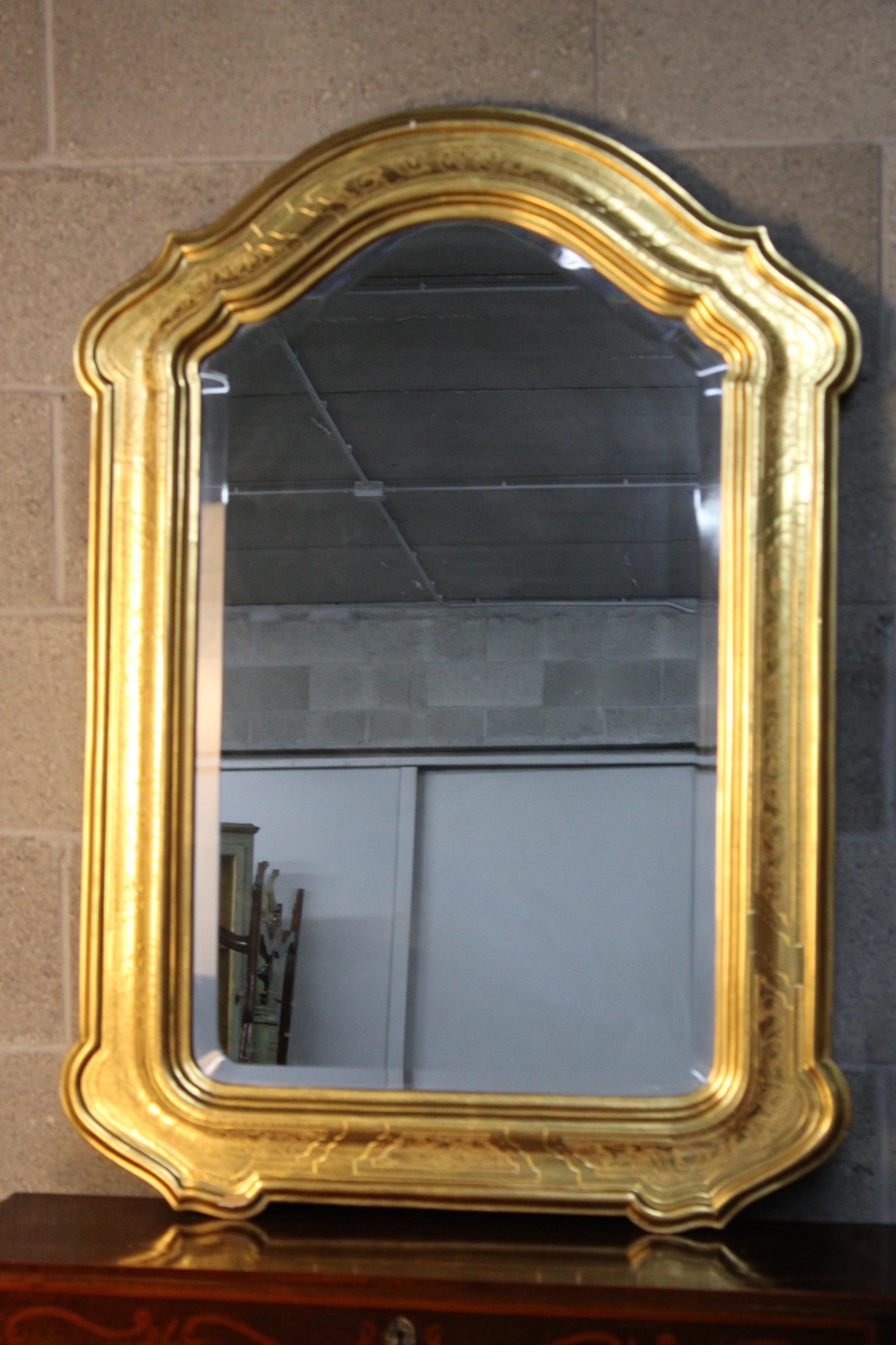 XX.century Louis Philippe style  golden wall mirror circa 1900-1920 Italy  
carved wood and used original golden 24K to cover the frame 
Beautiful rich detailed work on the frame .
will be shipped inside a wood secured box
storage and container