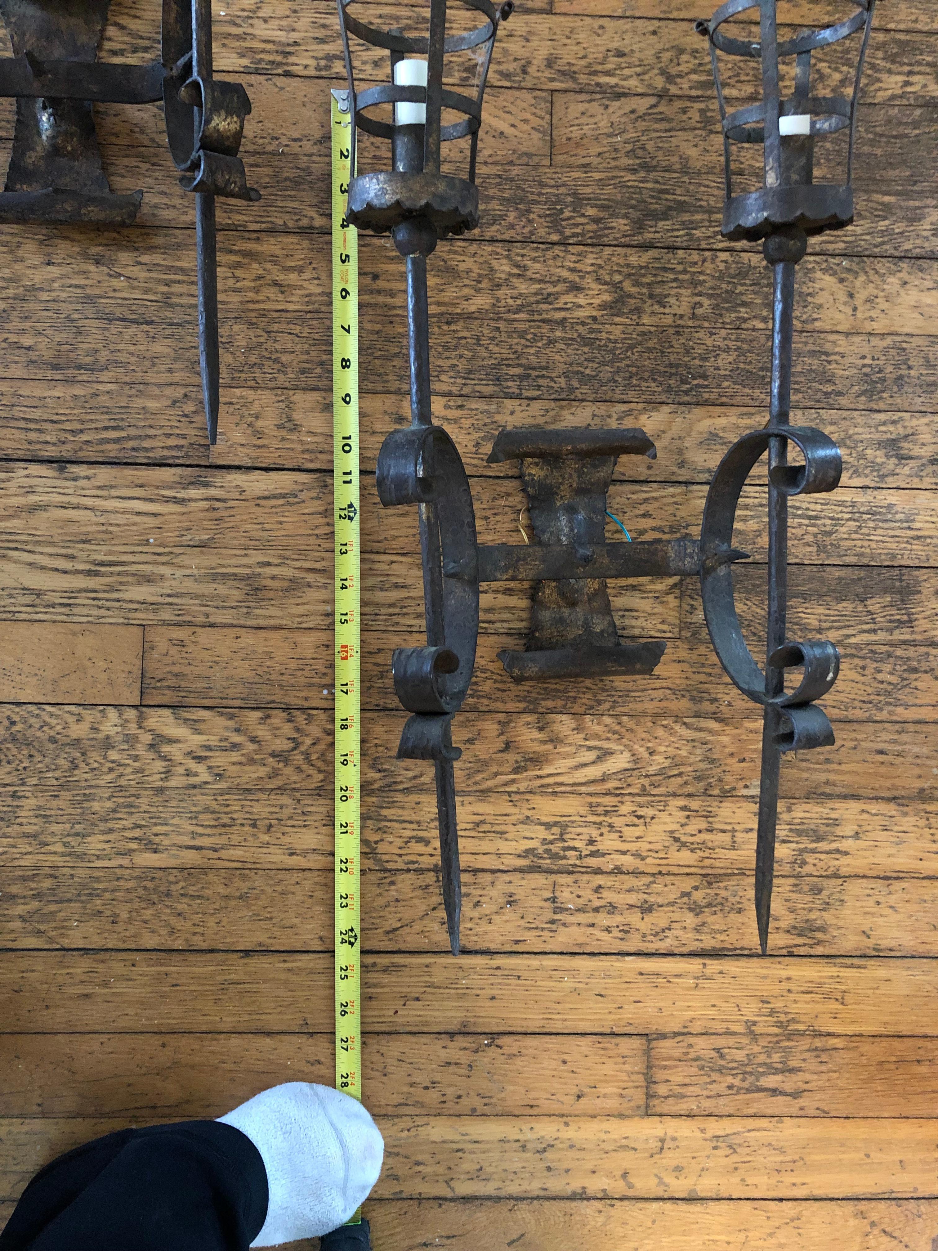 Character rich large pair of antique Gothic brass wall sconces that look like they came from a castle!  Two arms in each with open cages around the sockets and handsome masculine design.