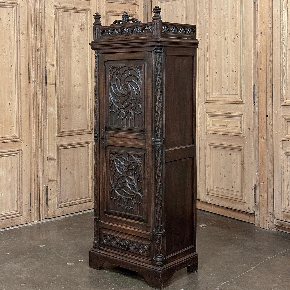 19th Century Gothic Bonnetiere ~ Petite Armoire is a testament both to the enduring legacy of the style that dates back to the mid 12th century, as well as the talented artisans of France that produced such an intricate yet sturdy piece for your