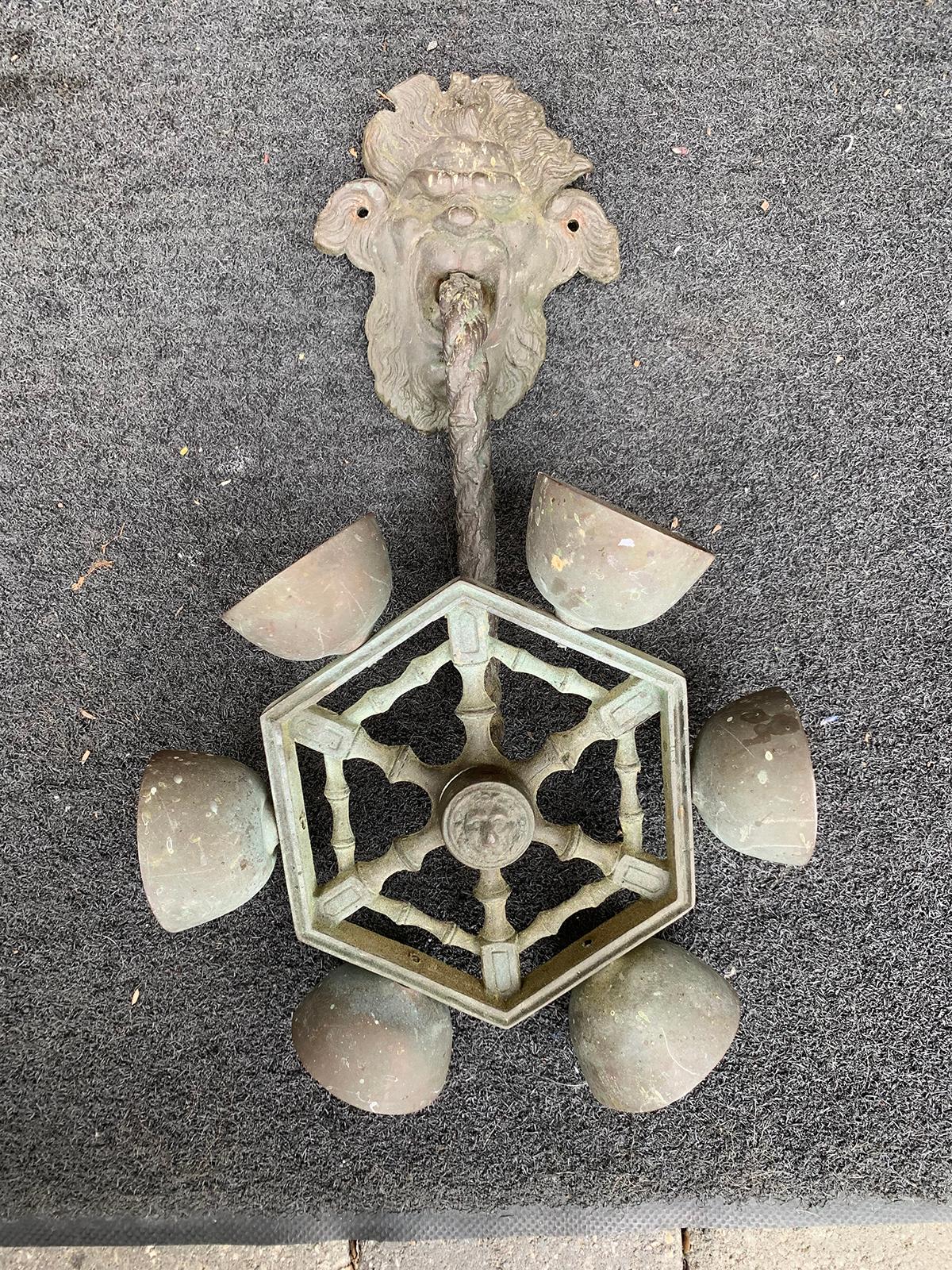 19th century Gothic Revival bronze doorbell with faces.