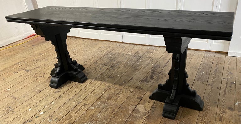 Two in one, this 19th century recreation of a 15th century Medieval style great table has the unique feature that the top can be folded in half making it into a console or sofa table. Open it up and it becOMES a dining table. Great for a small space