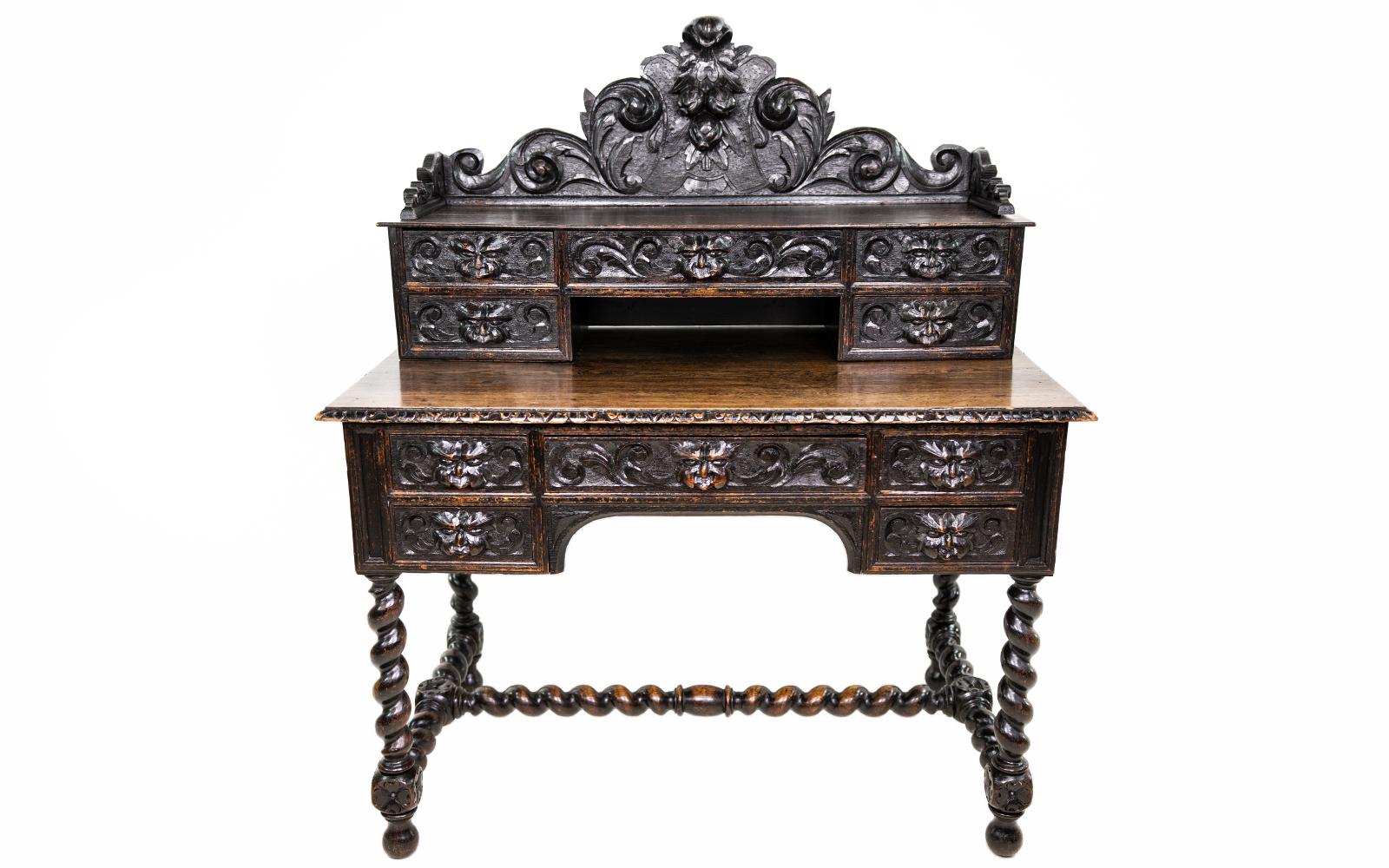 Description

Oak carved green man desk

Antique Victorian Green Man solid oak Gothic revival writing desk.

Tooled leather inset top over an arrangement of five drawers with a further five drawers to the top section, all with carved masks and