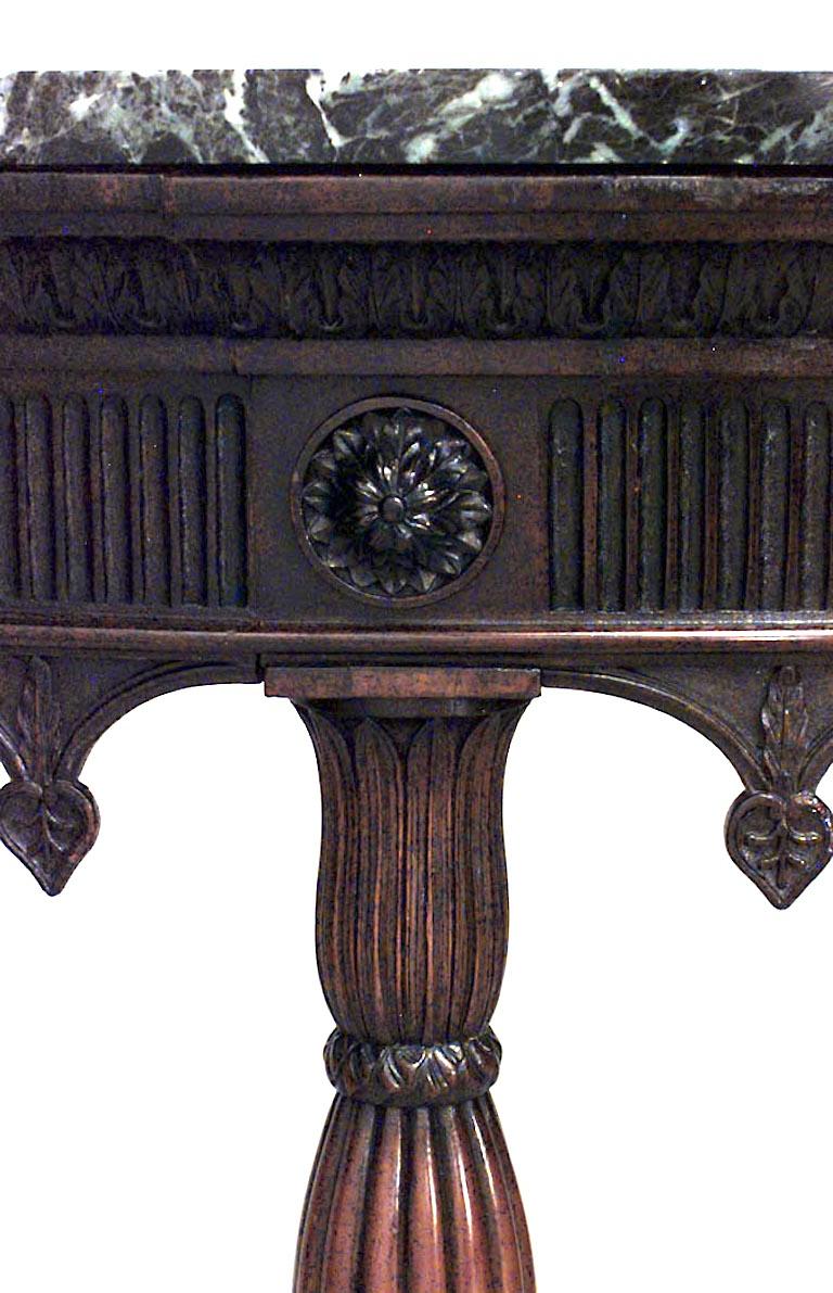 Nineteenth century English Gothic Revival mahogany demilune console table with a green marble top supported by an arcaded apron and four carved legs joined by a curved stretcher.