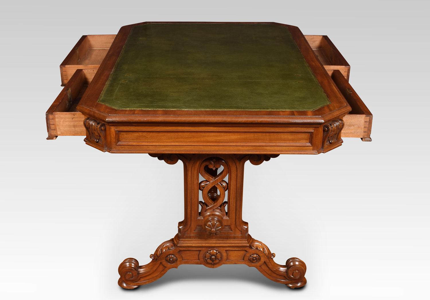 19th century mahogany Gothic style library table, the large rectangular top with canted corners having tooled inset leather writing surface. The freeze fitted with two moulded draws and two opposing draws. One draw stamped Johnstone & Jeanes, 67 New