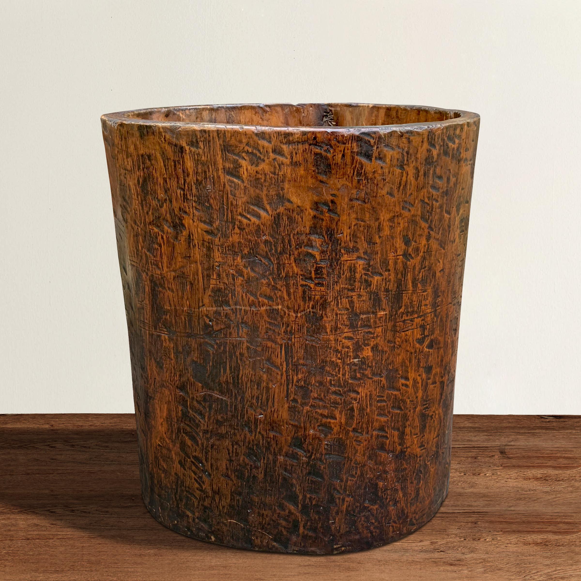 A fantastic 19th century grain barrel hand-hewn from a single tree trunk, and retaining traces of its original finish. Barrels like these have been used throughout the Eastern US, Northern and Western Europe, and parts of Asia to protect stored