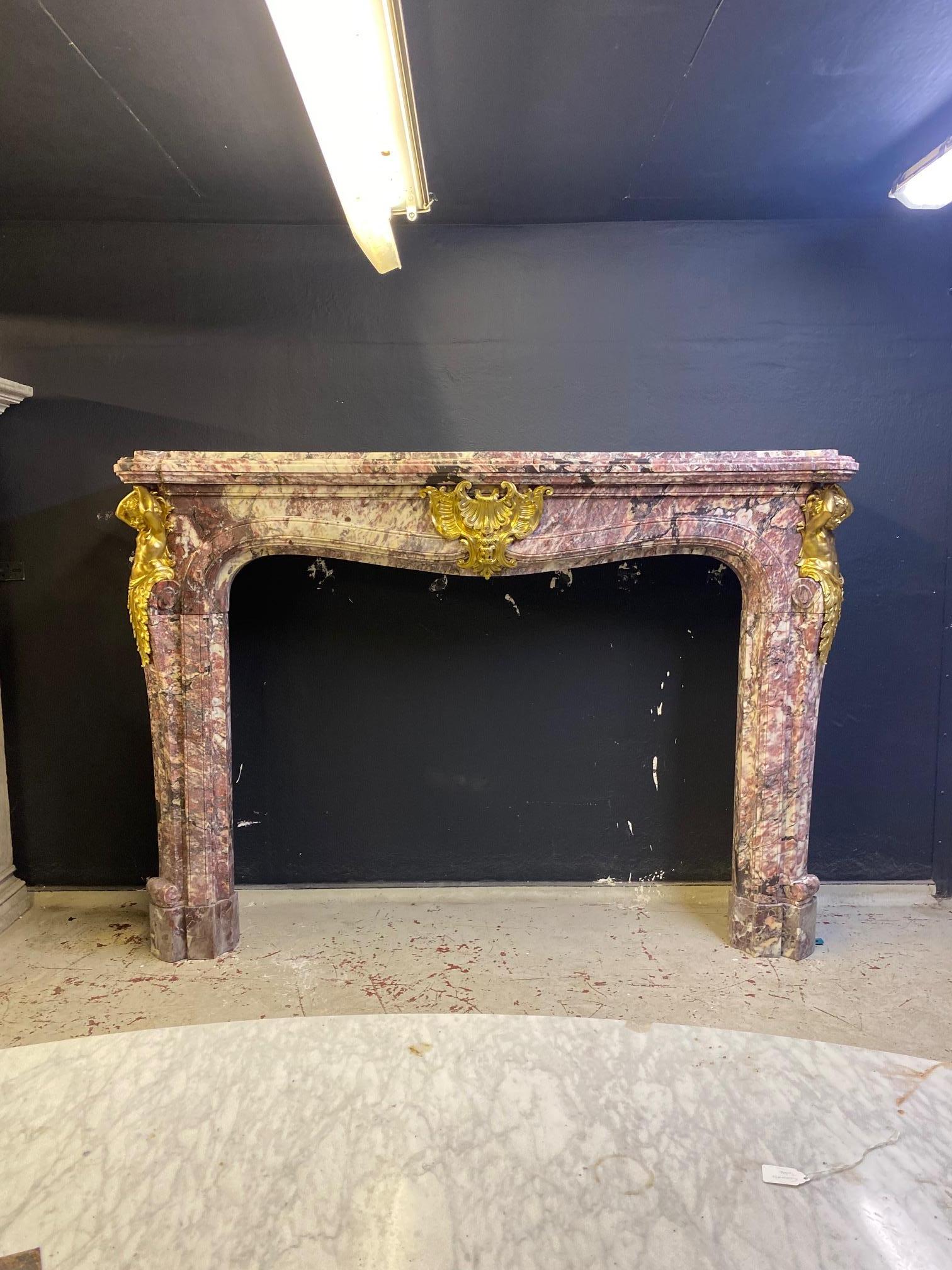 Carved 19th Century  Grand French Chateau Chimneypiece in Fleur de Peche Marble For Sale