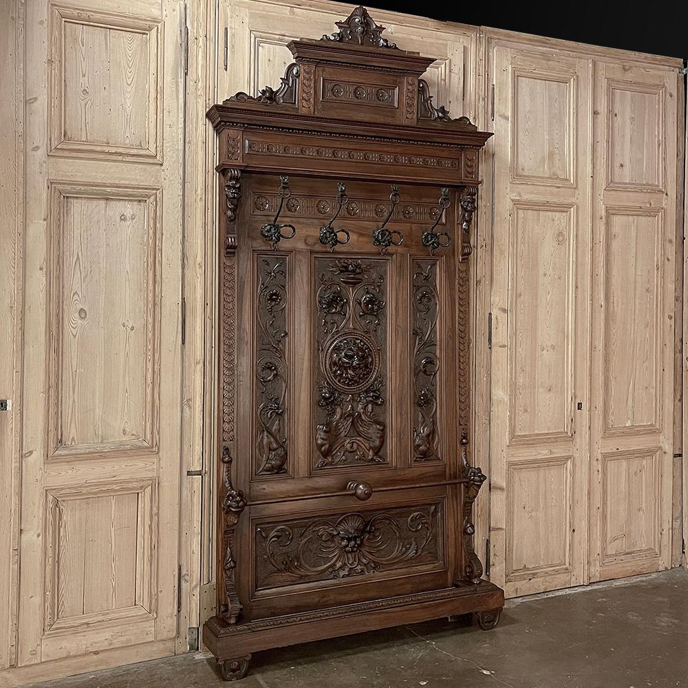 19th Century Grand Italian Renaissance Walnut Hall Tree was crafted on a large scale to both welcome and impress visitors and family!  Reaching to ten feet in height, it was created by master cabinetmakers utilizing sumptuous walnut, sculpted in