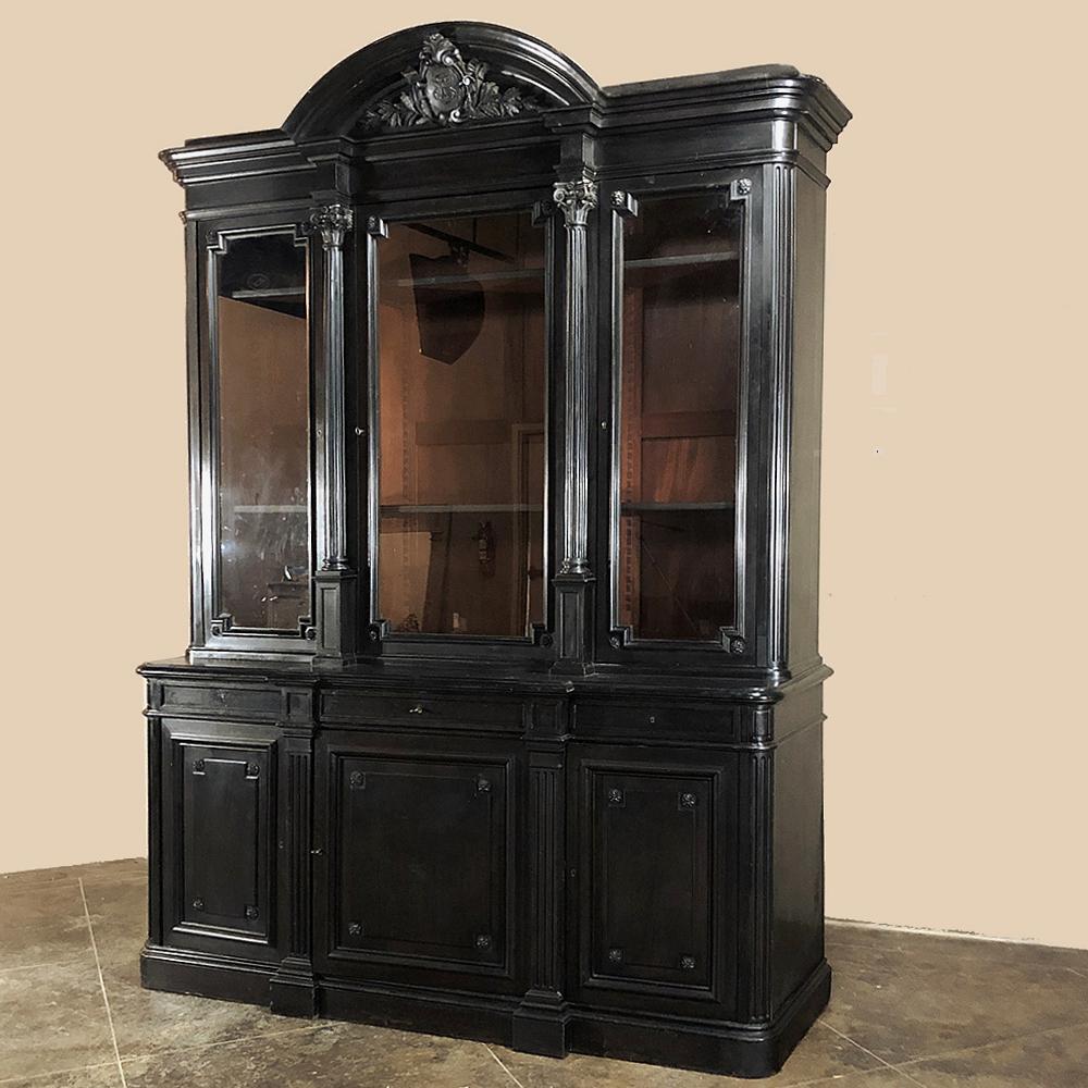 19th Century Grand Napoleon III Period ebonized triple bookcase is the perfect choice to make a bold statement in any room! Only a very affluent household could afford both the home suitable for such a piece, the education to appreciate the books it