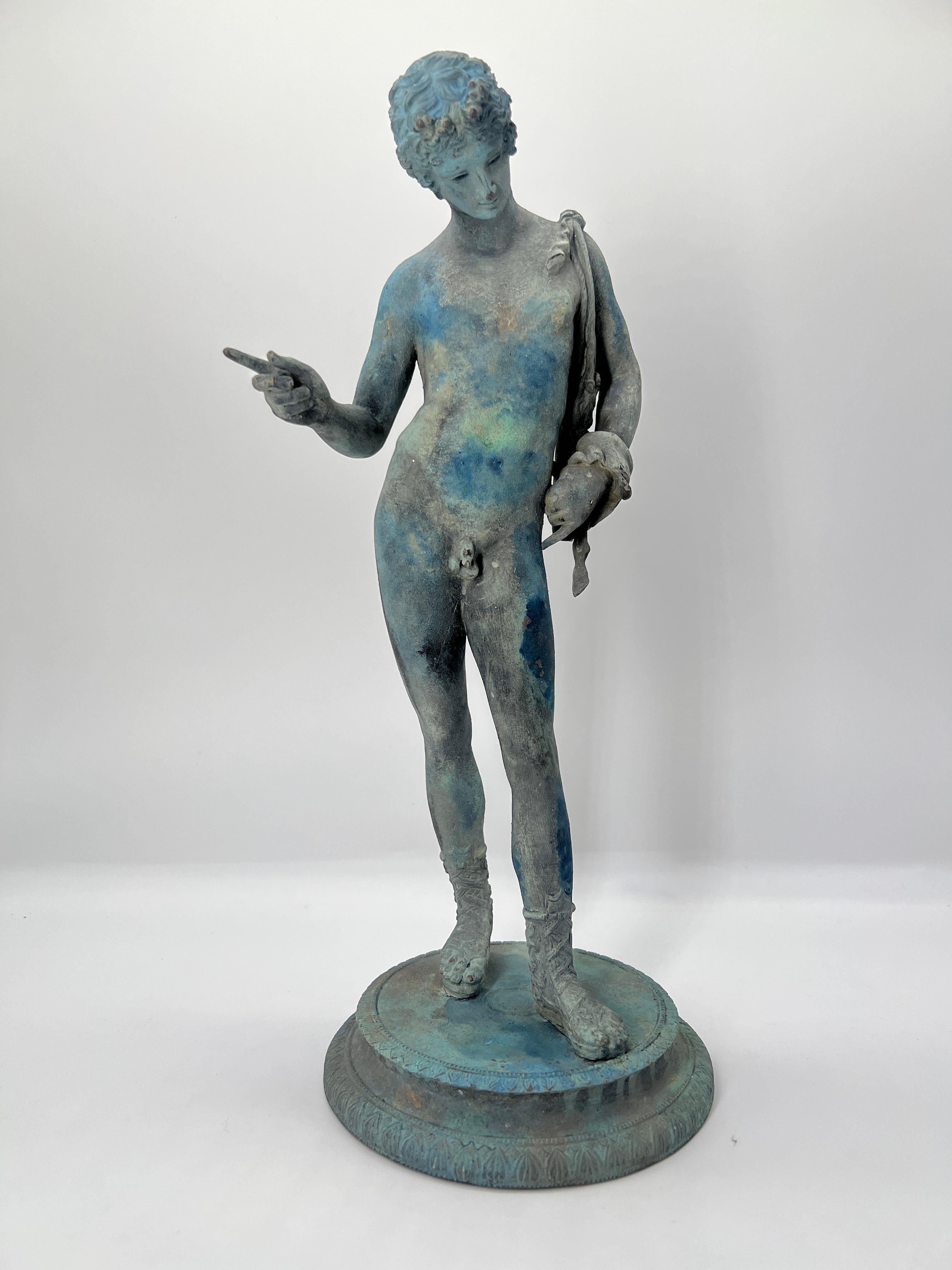 Italian, late 19th century.

A 'Grand Tour' patinated bronze figure of a young man, representing Dionysos (Bacchus), previously thought to be Narcissus. 

Good quality with heavy patination to surface. Coveted by the 19th century intellectuals and
